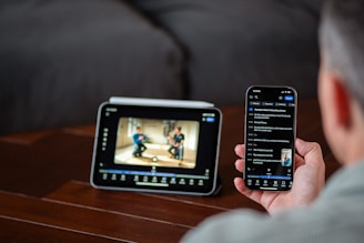Person watching video on tablet and phone