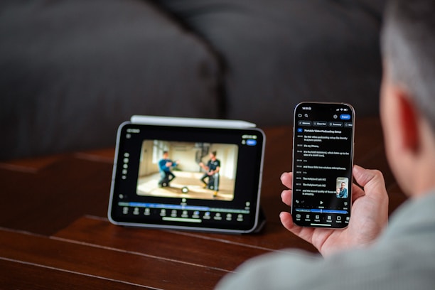 Person watching video on tablet and phone