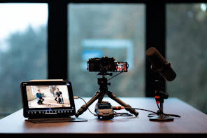 Camera, monitor, and microphone setup for recording.