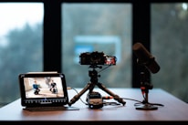 Camera, monitor, and microphone setup for recording.