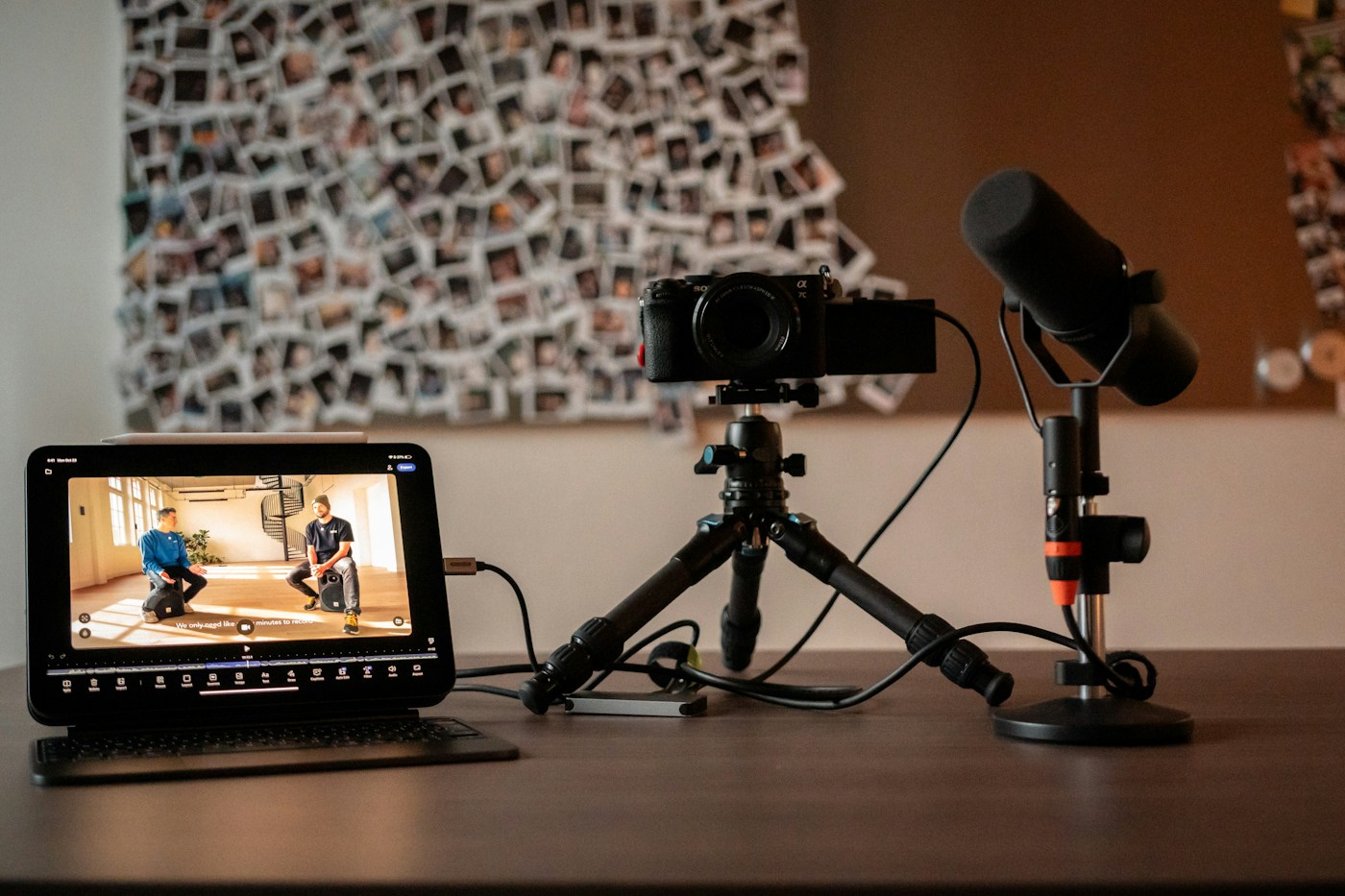 Camera, microphone, and monitor on a creator's desk — every video is a landing page that compounds