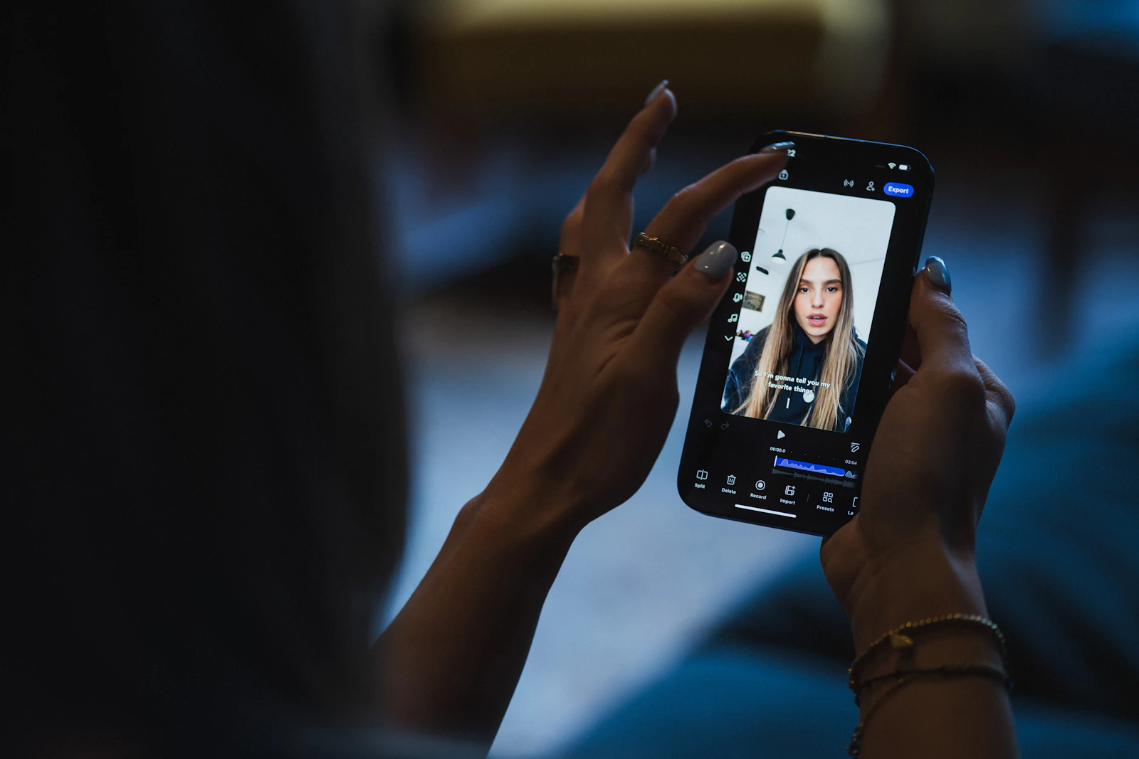 A creator filming herself with a smartphone held in both hands