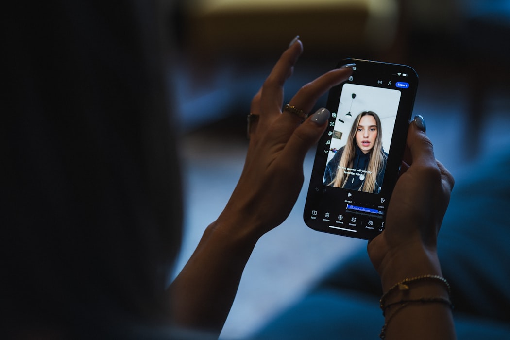 A close-up of a person watching a short-form shoppable product video on a smartphone screen.