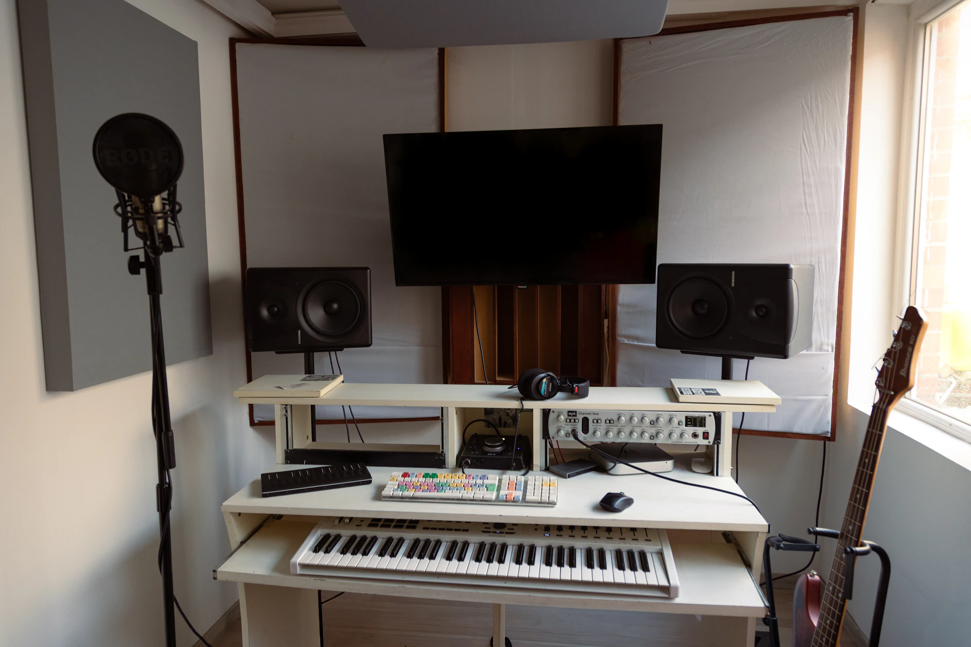 Music production room with instruments used as representative service imagery