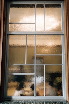 Frosted glass window with geometric panes and rectangular panes.