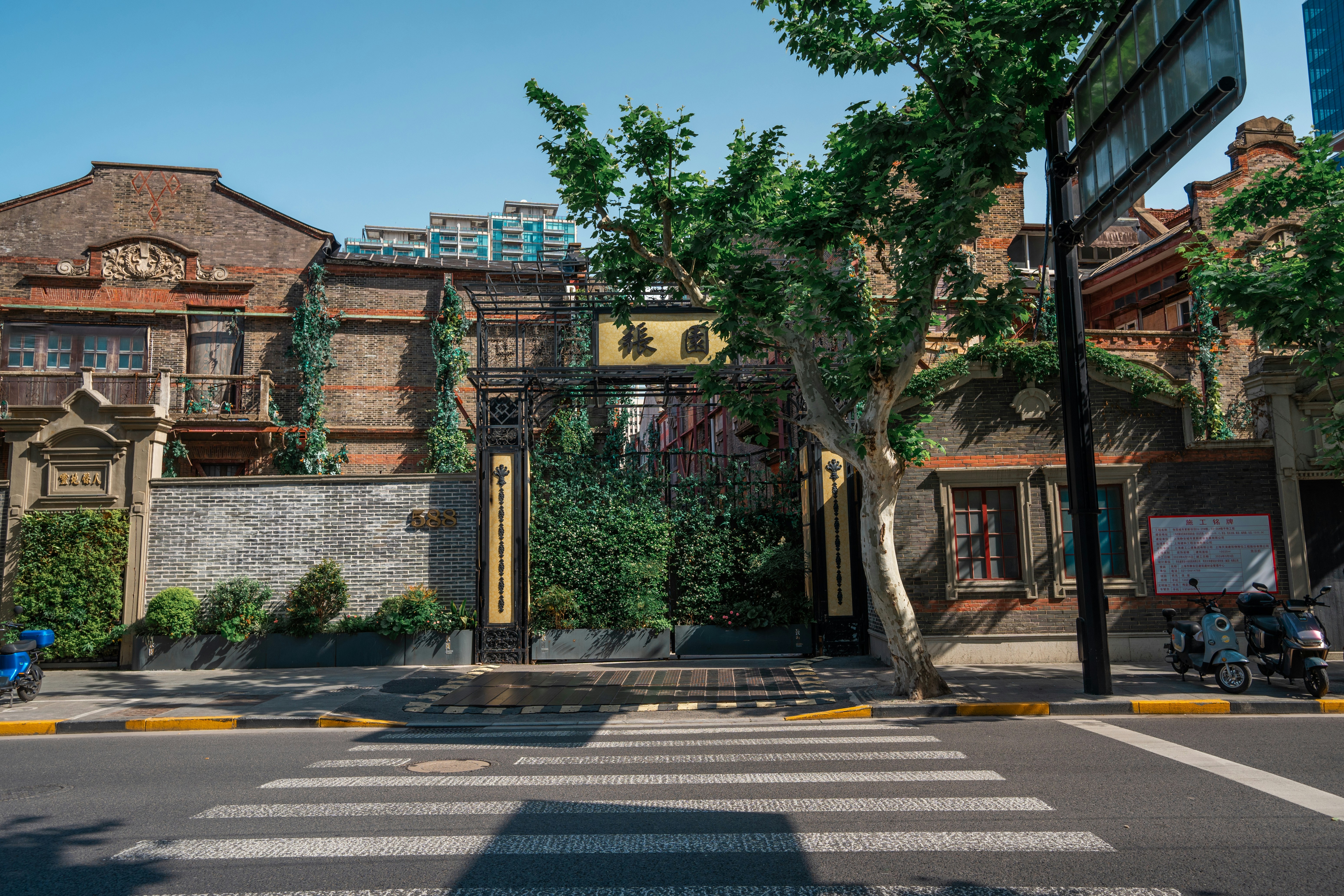 Historic buildings line a street with a crosswalk.