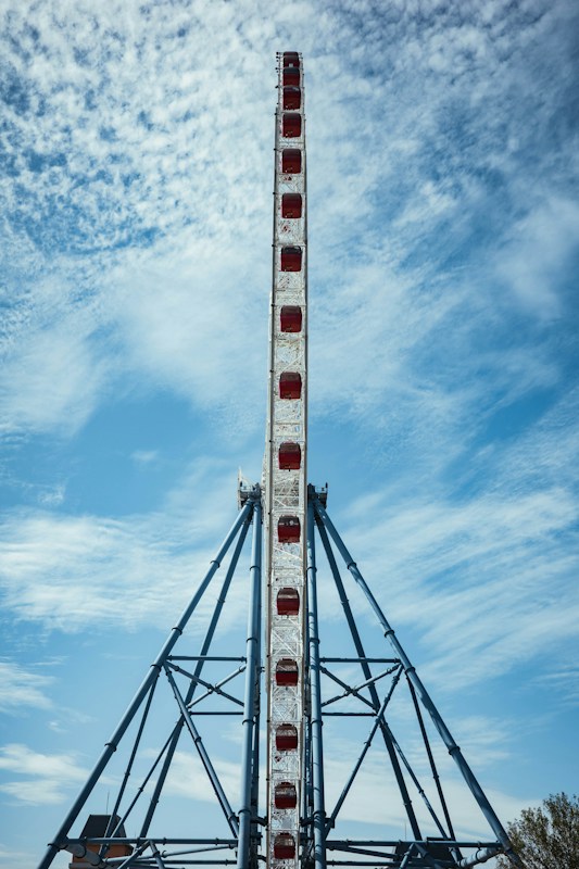 The Sky Dream Ferris wheel with red cabins at Lihpao Land in Houli, Taichung, against a blue sky