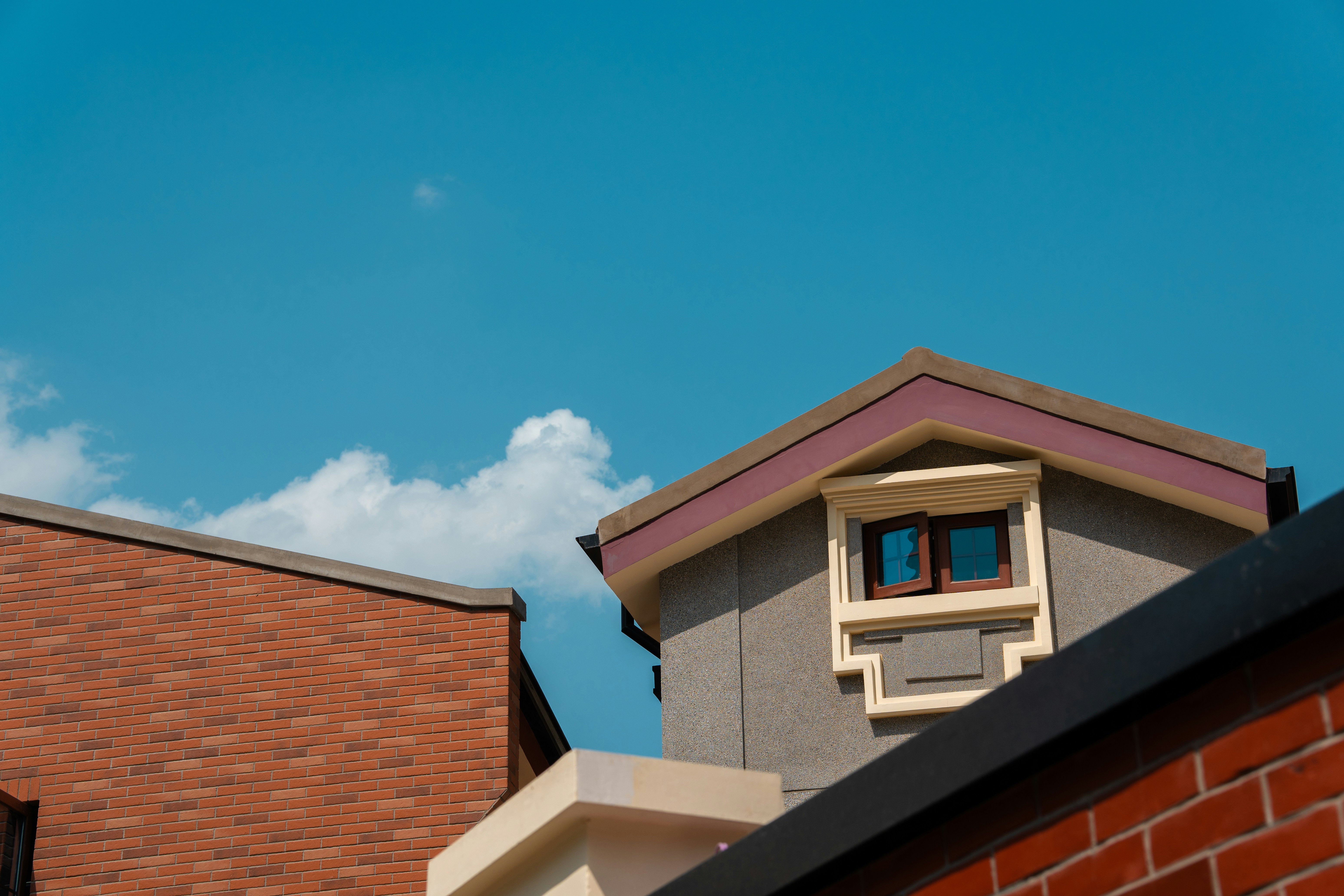 Roofs and sky with scattered clouds