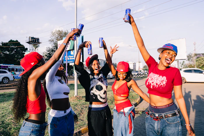 Friends raising their drinks outdoors