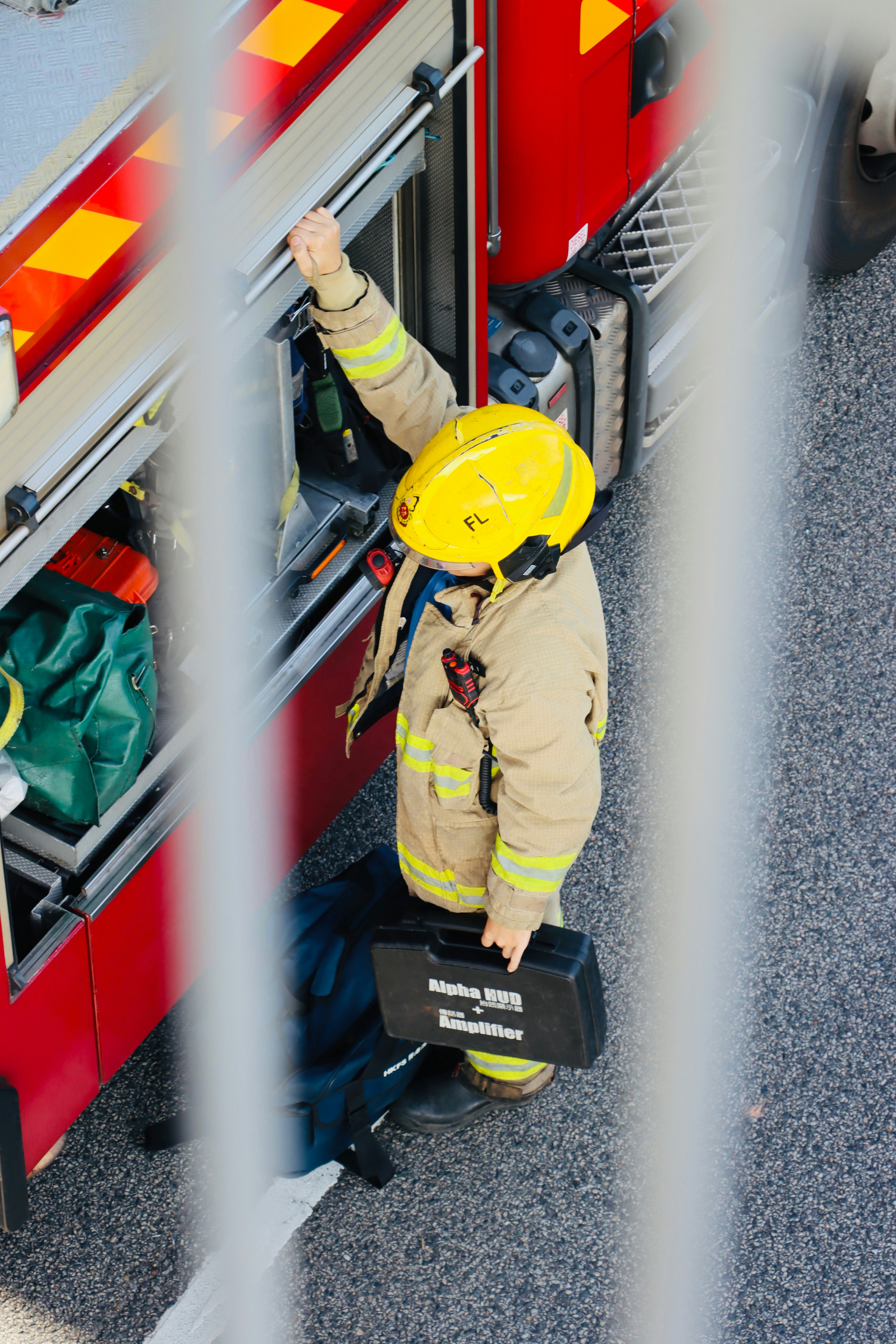 Firefighter in uniform with helmet and case