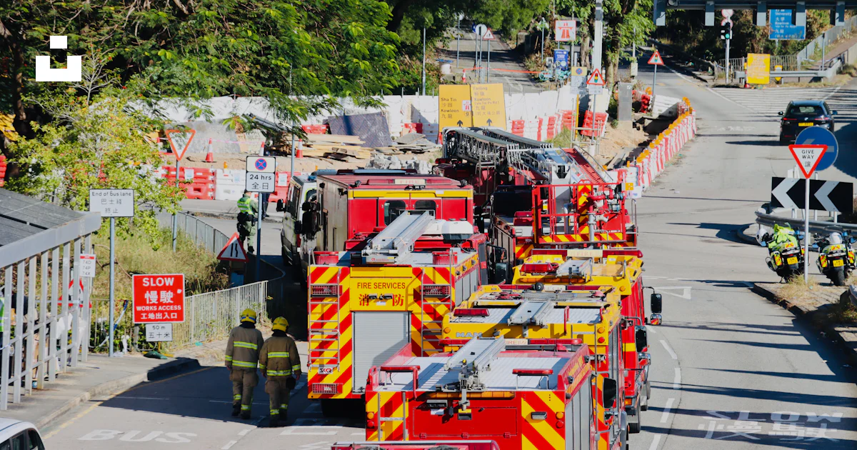 Fire Engine Assisting Construction Fire trucks and emergency personnel at a construction site. photo ...