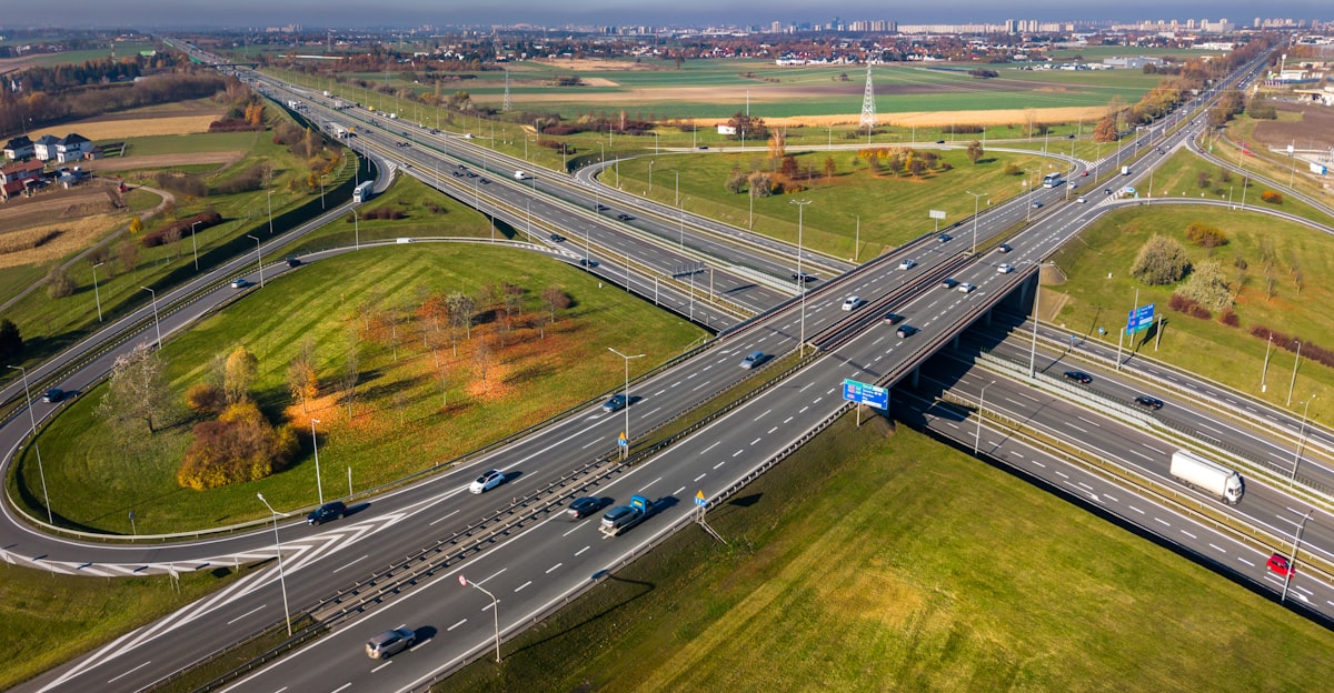 Motorway with exit to an industrial zone with warehouses