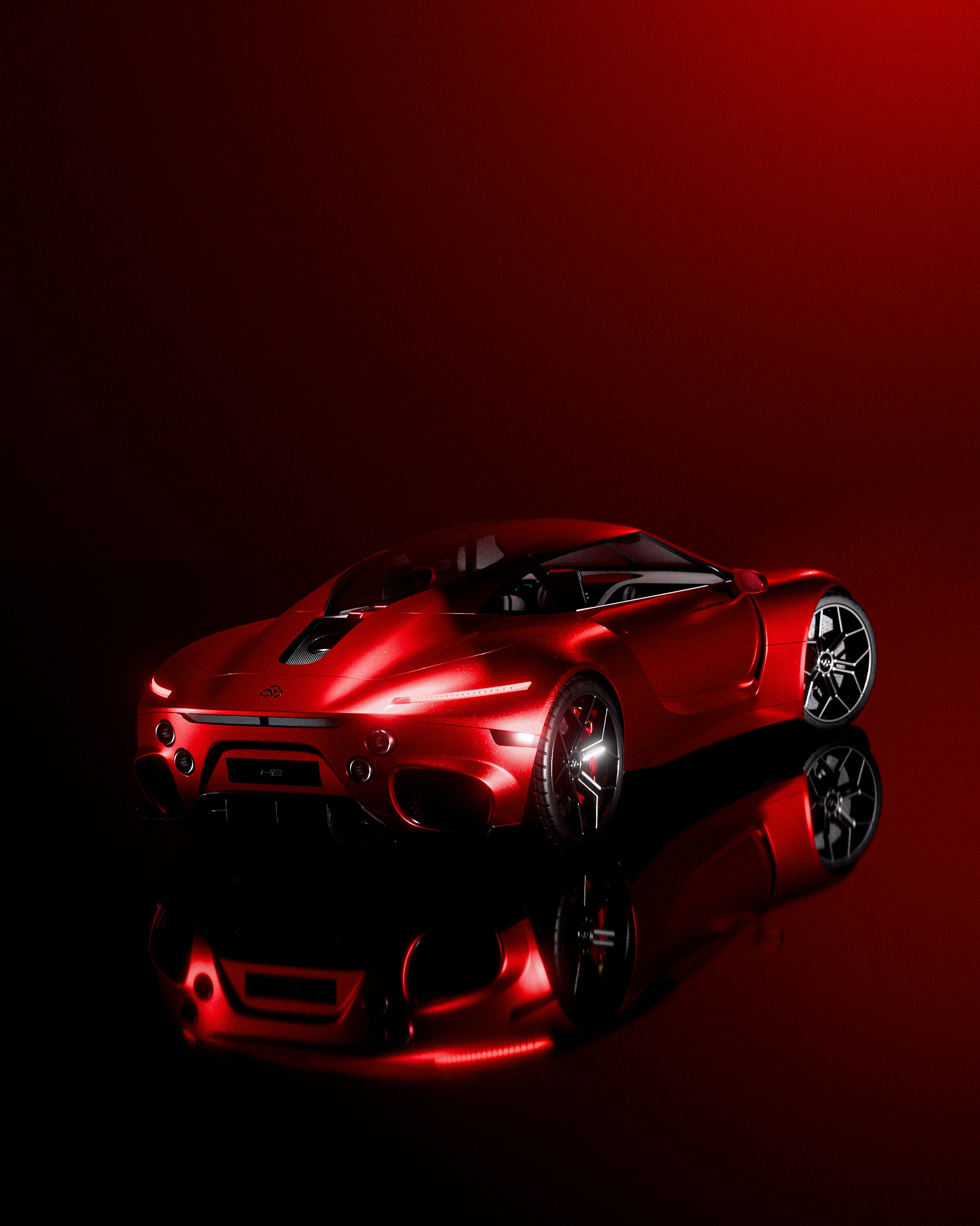 A sleek red sports car on a reflective surface.