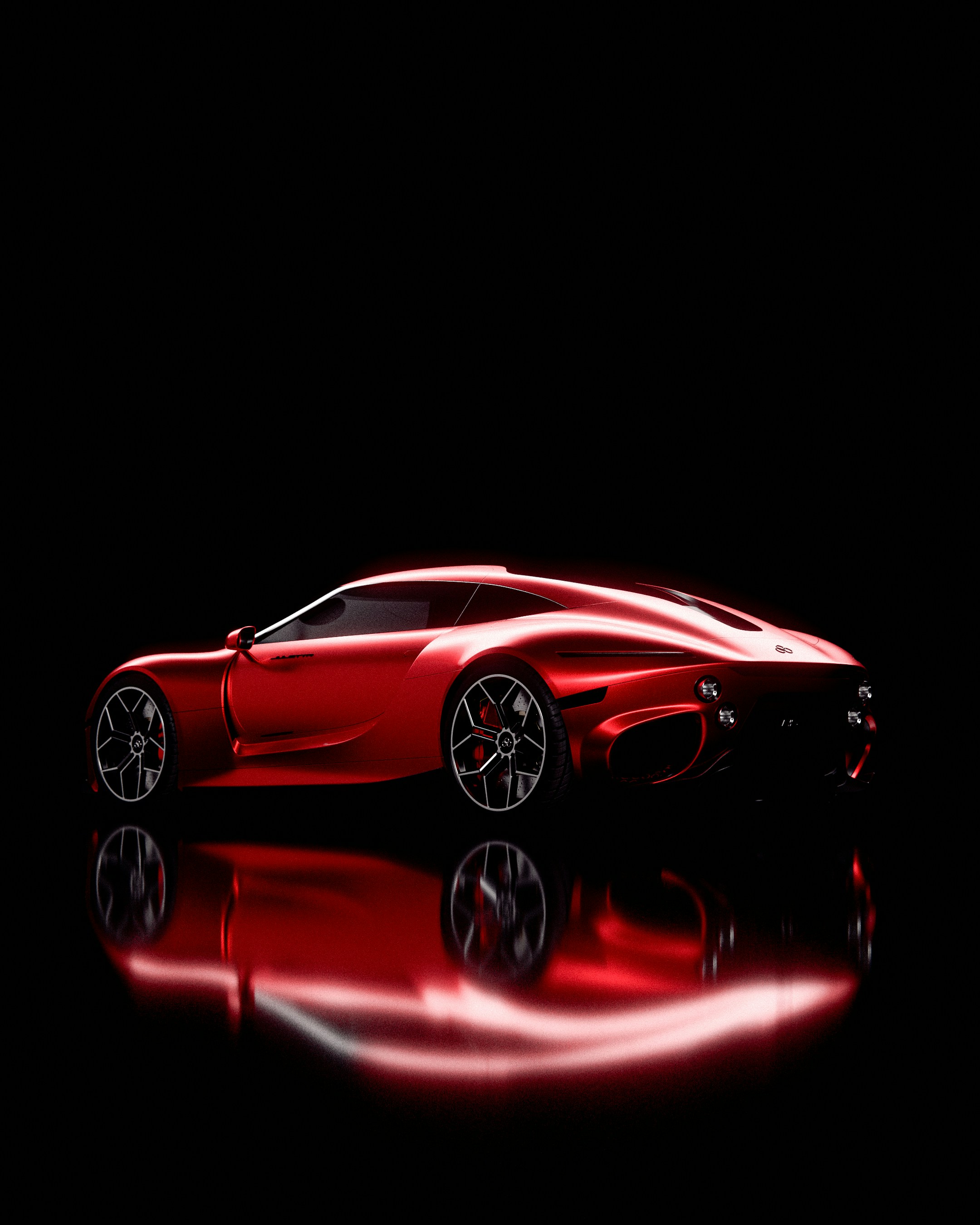Red sports car reflected on a black surface