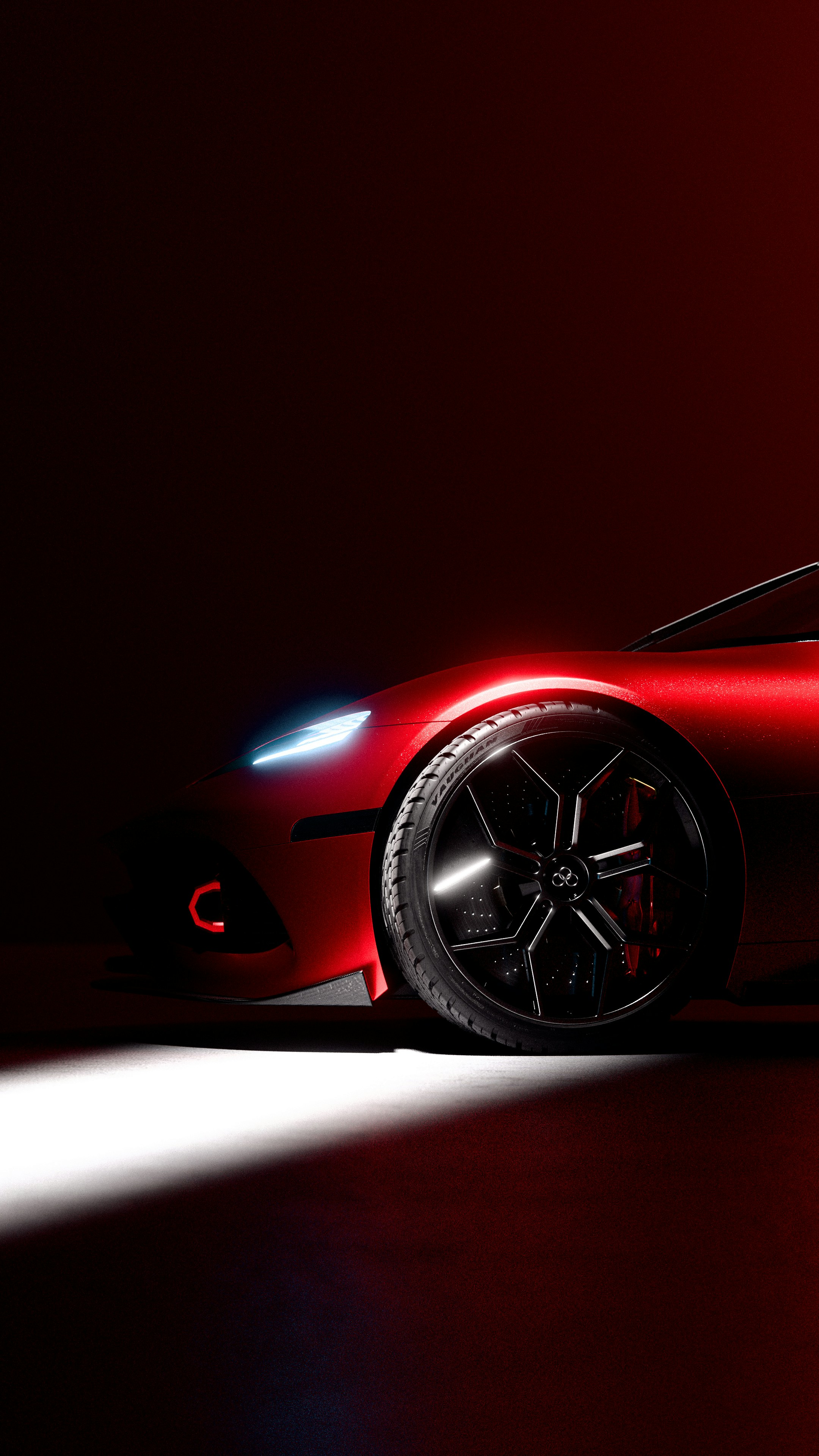 Red sports car with sleek headlights and custom wheels