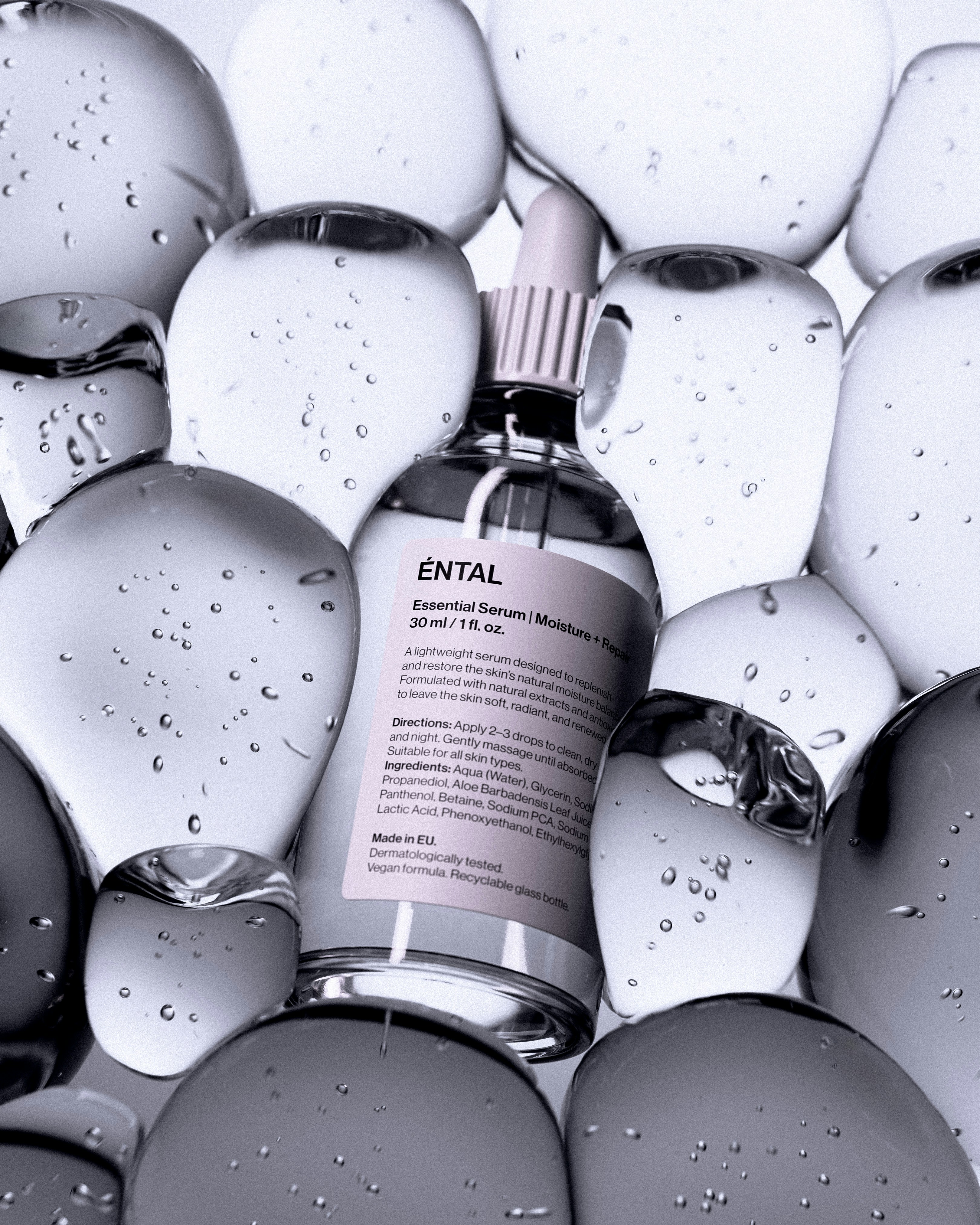 A bottle of serum surrounded by clear, rounded shapes.