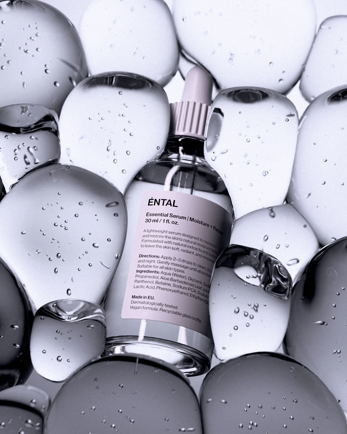 A bottle of serum surrounded by clear rounded shapes