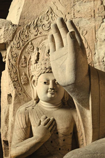 Ancient stone carving of a serene buddha figure