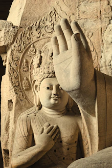 Ancient stone carving of a serene buddha figure