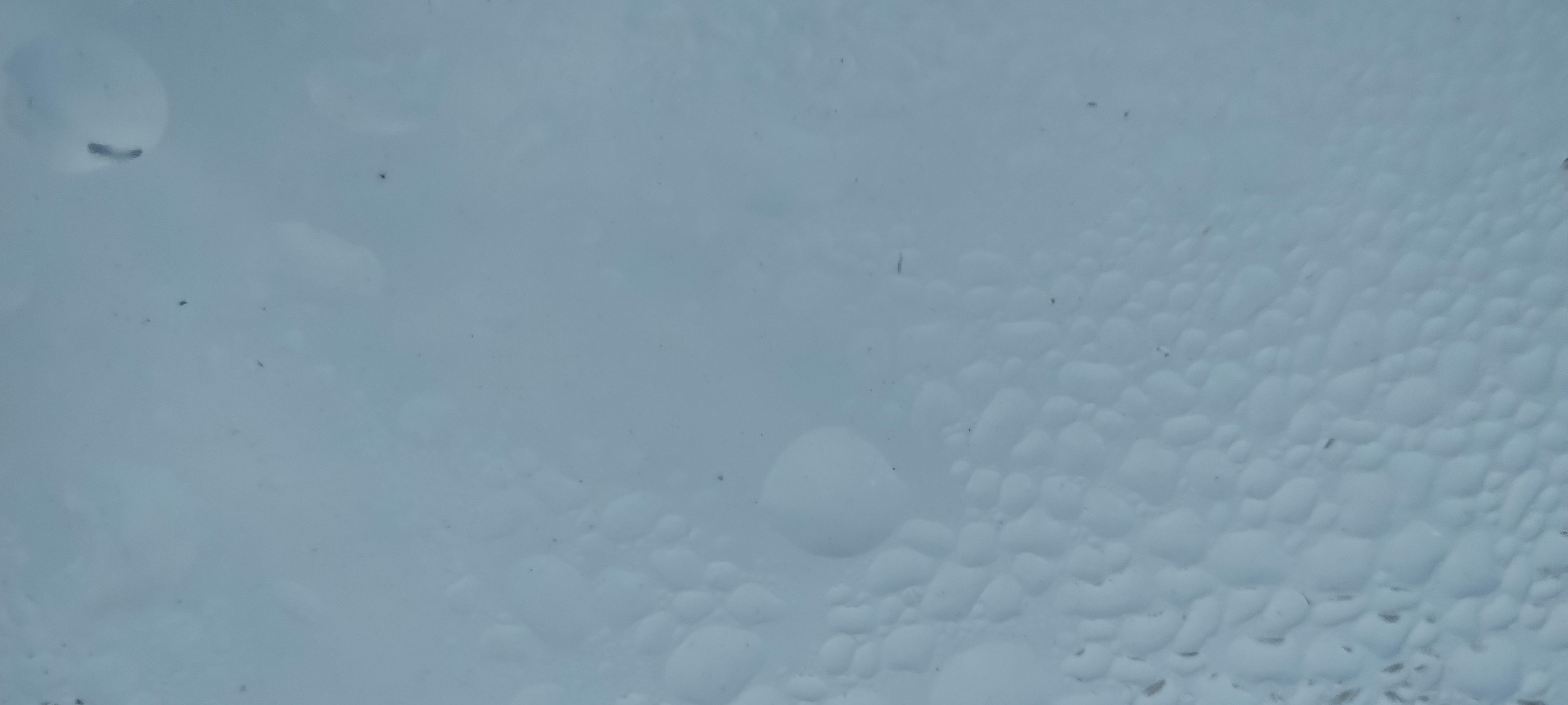 Water droplets on a blue surface