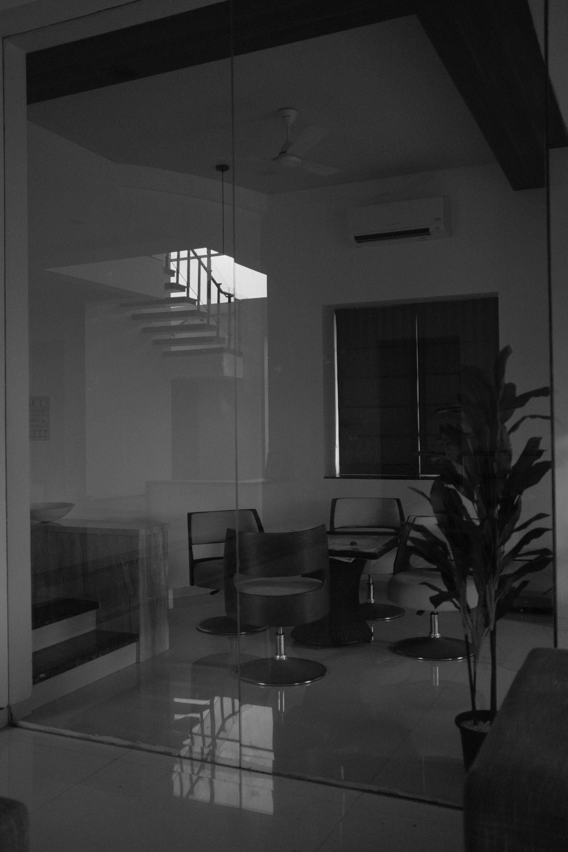 Modern interior with glass walls and staircase