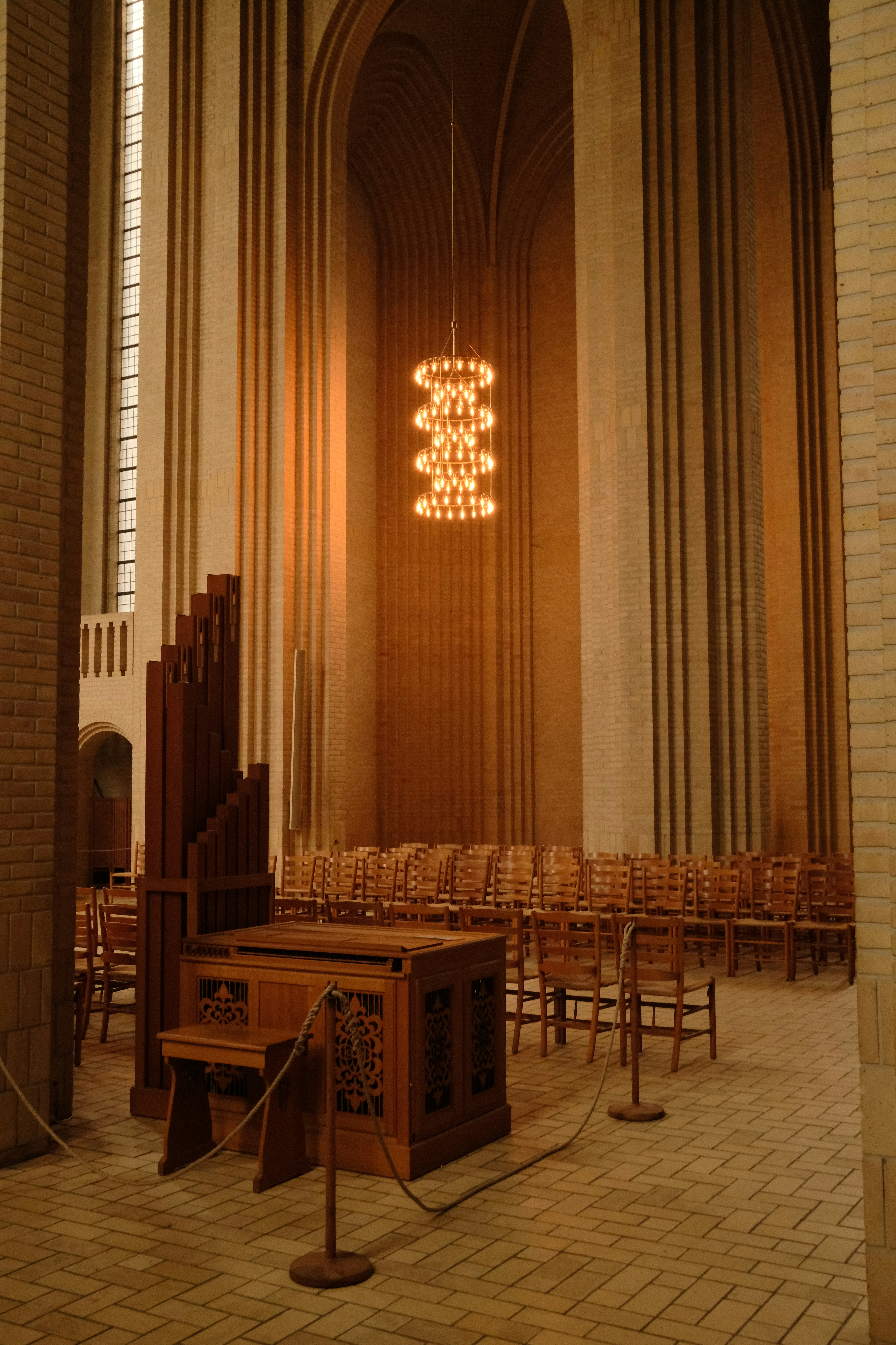 Pipe organ and chairs inside a grand church