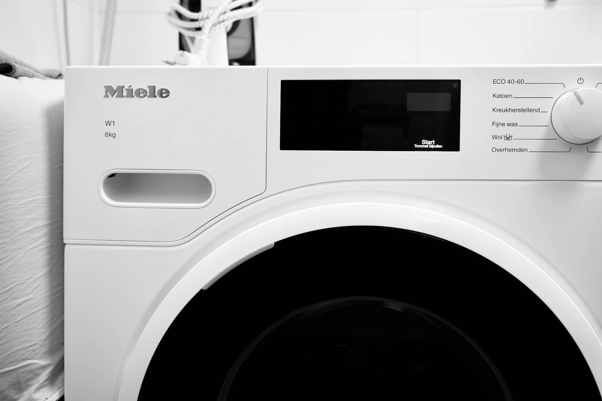 Close-up of a white miele washing machine
