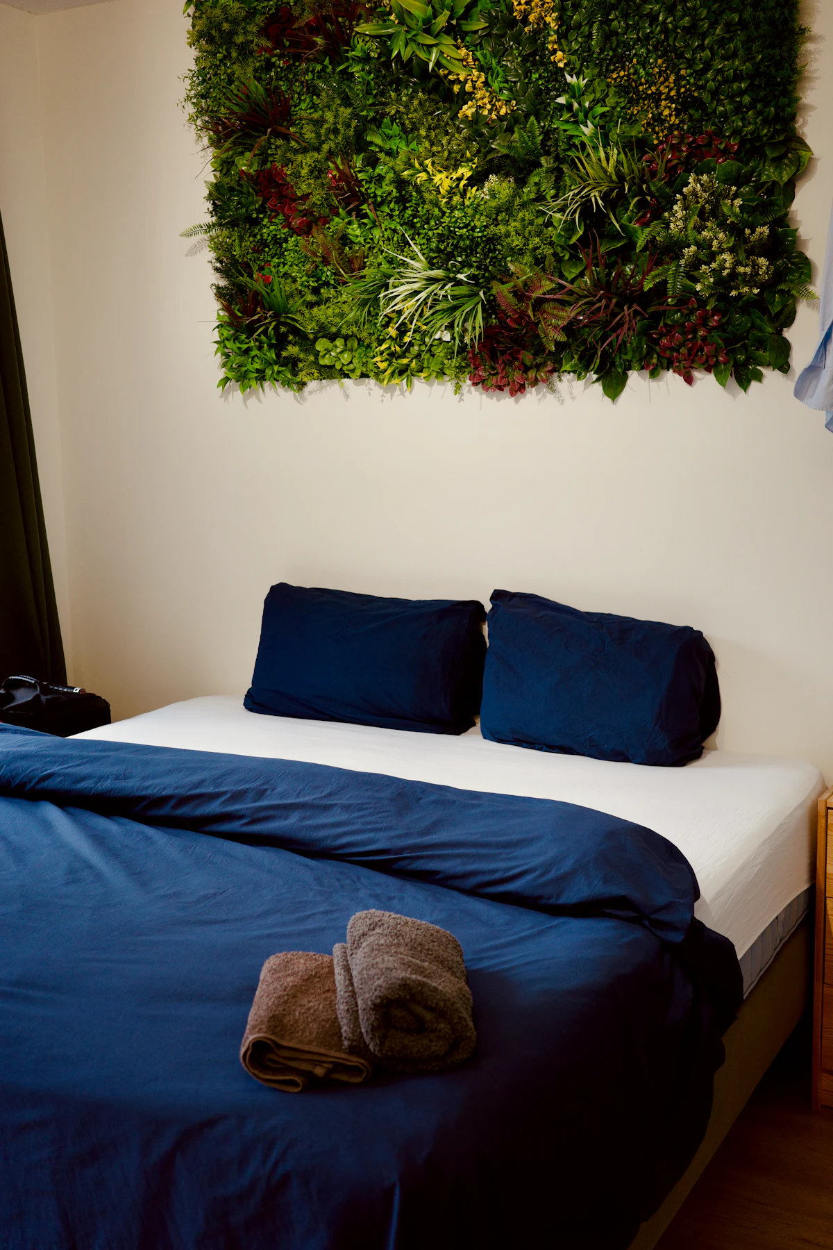 Green walls and a bed