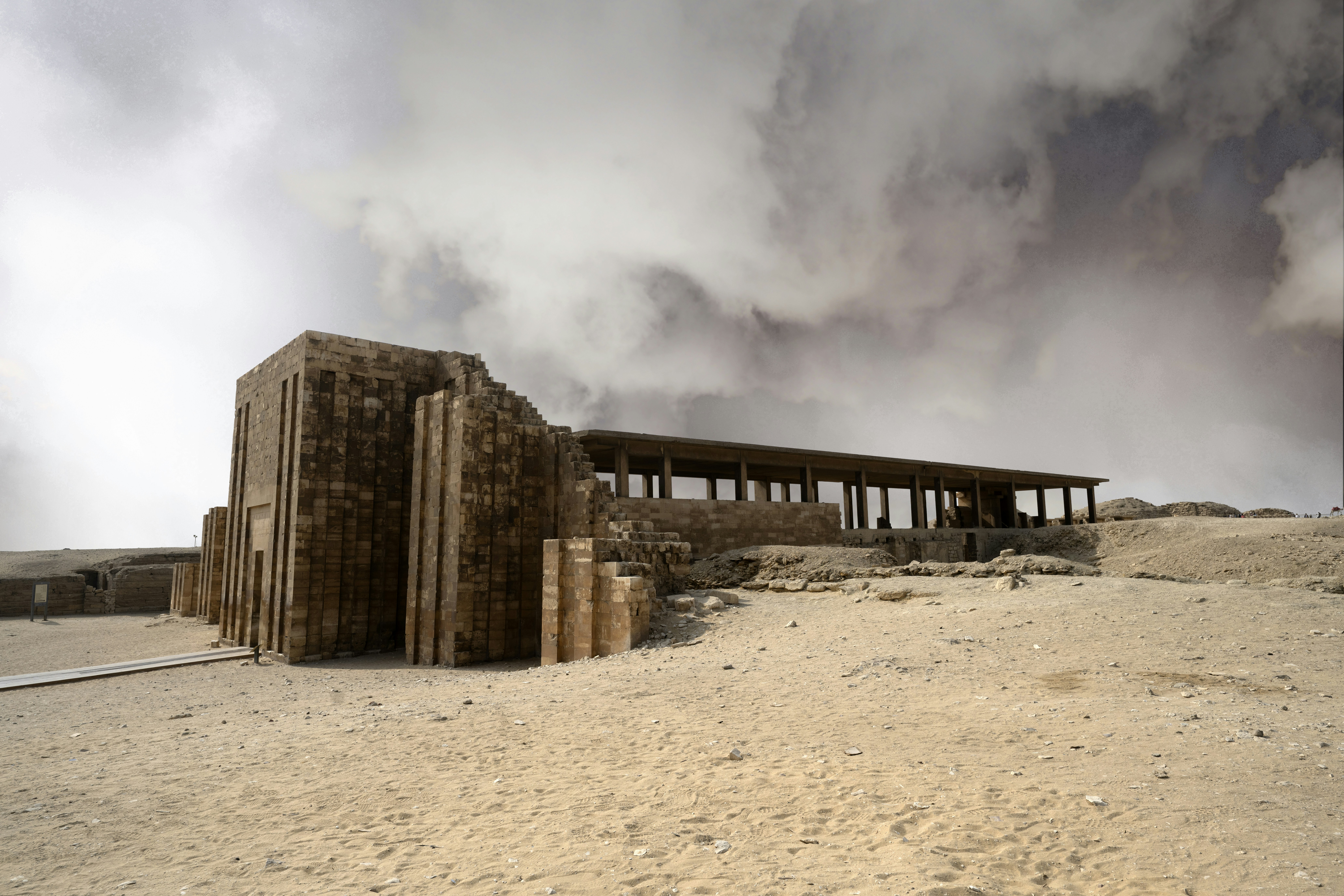 Ancient stone structure under cloudy sky