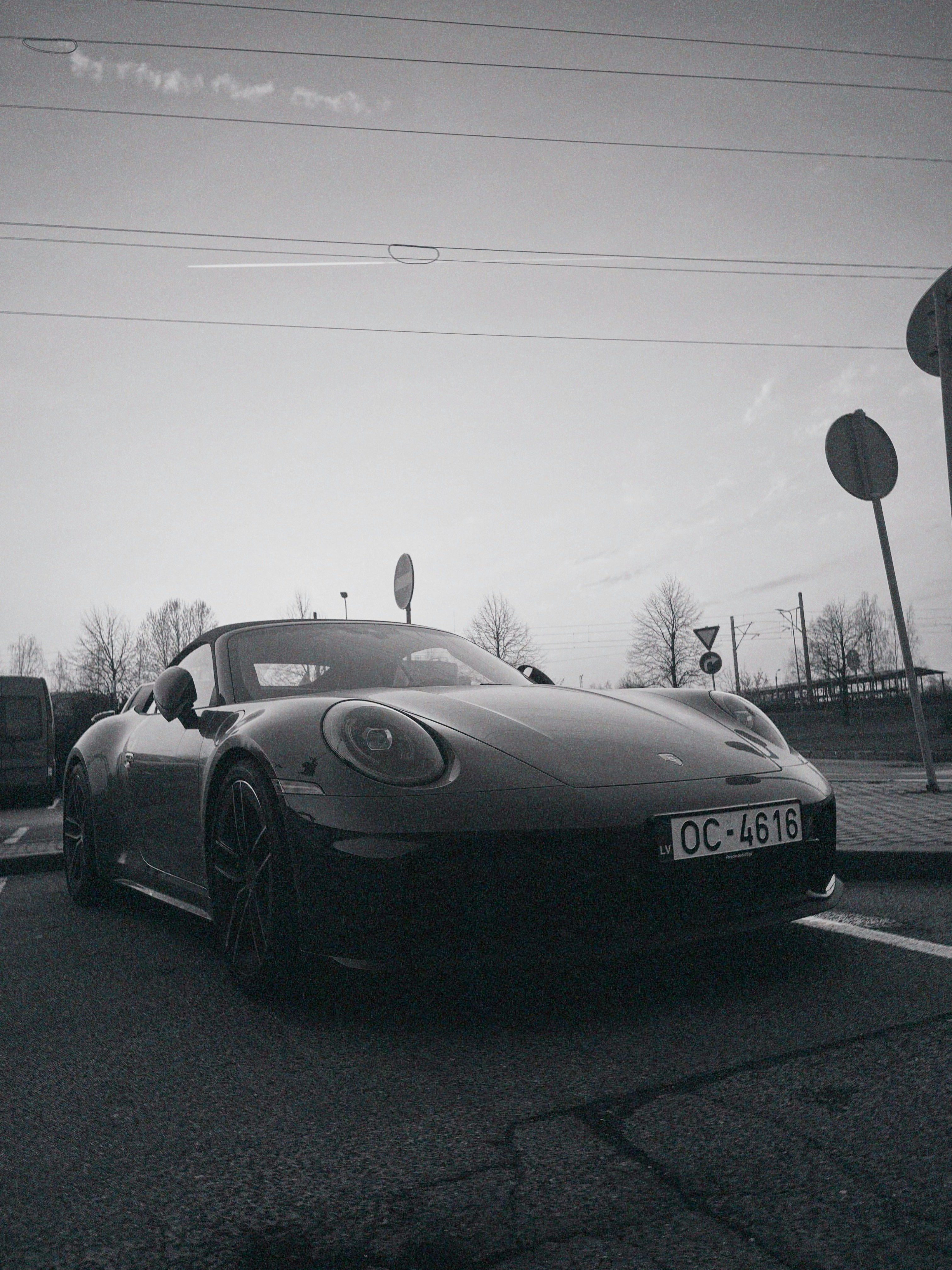 Black convertible porsche parked outdoors