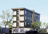 Modern apartment building with balconies and trees