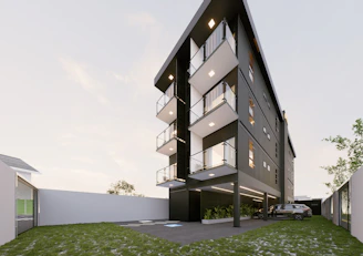 Modern apartment building with balconies and parking area