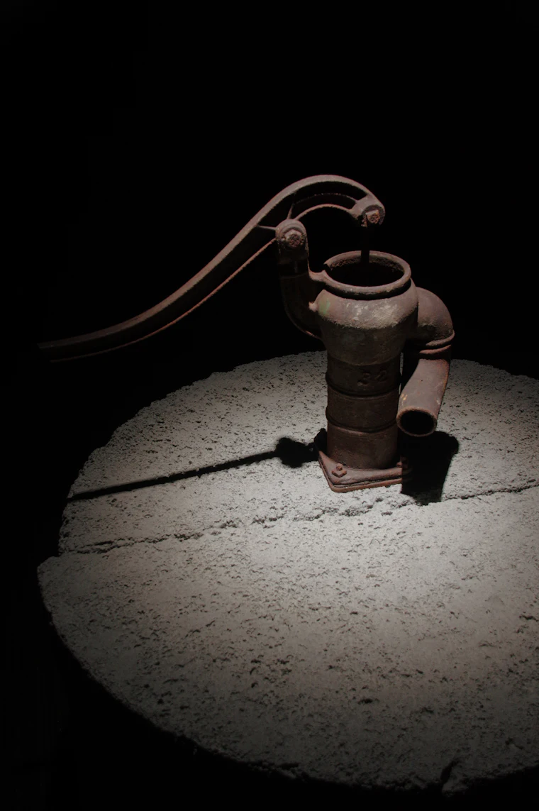Old hand water pump on a private well in rural Idaho