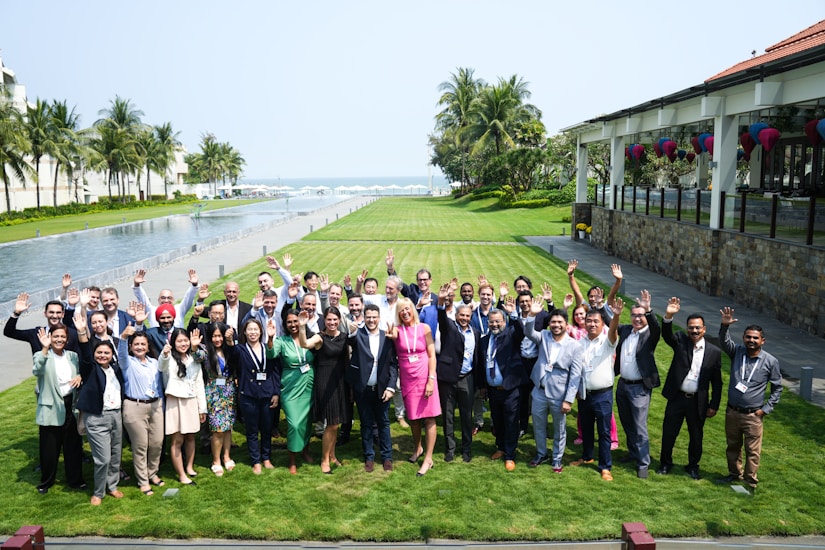 Group of people posing for a photo outdoors