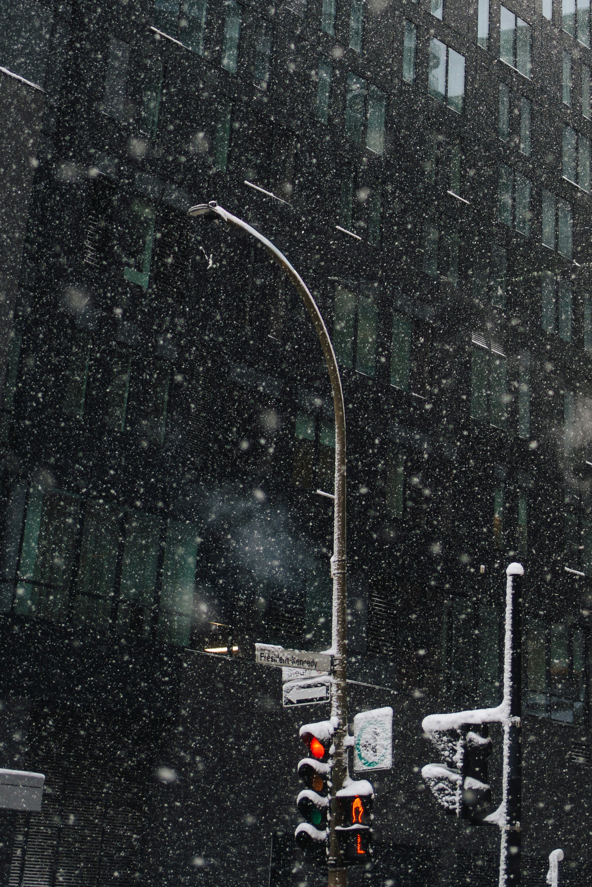 City streetlights in falling snow