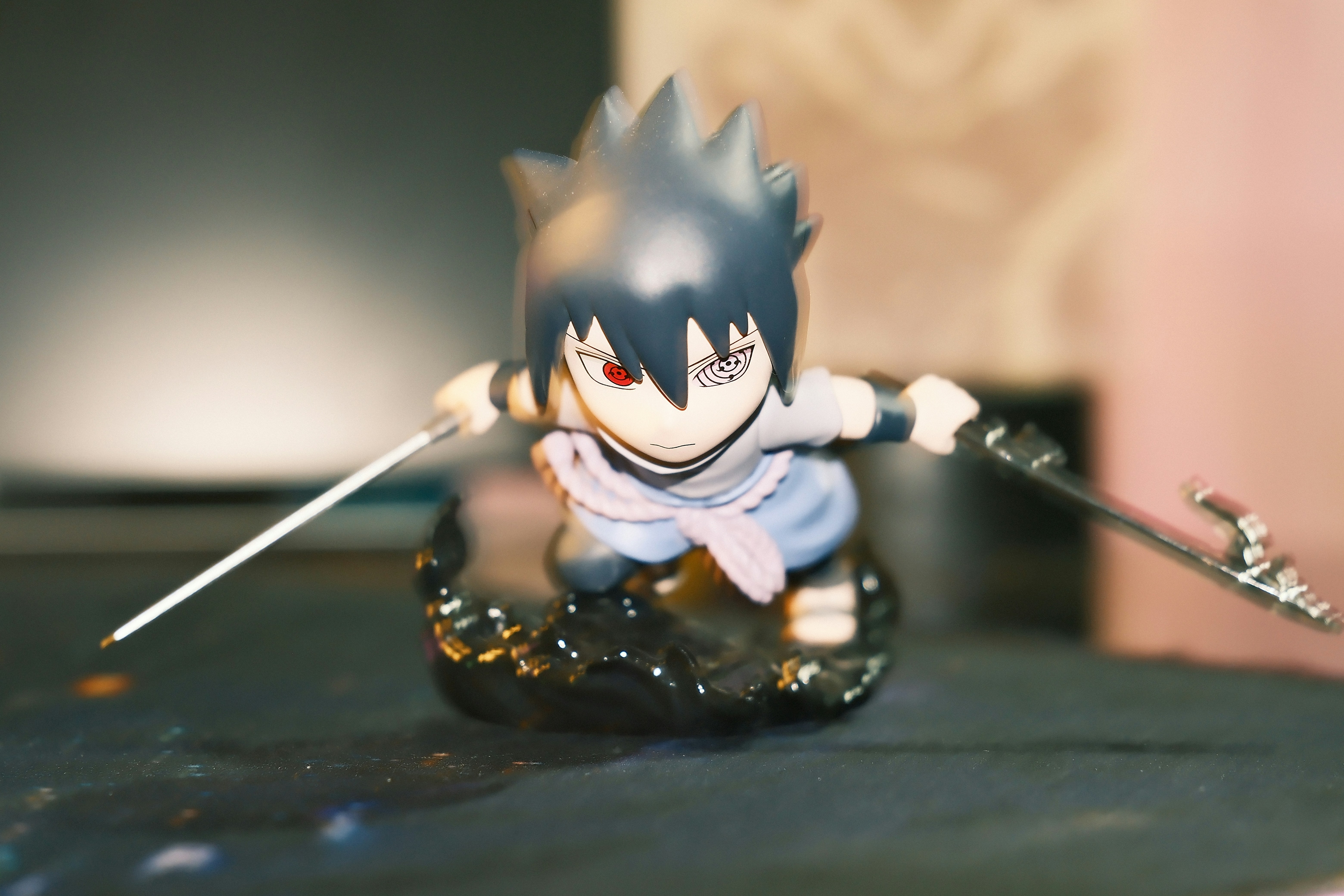 Chibi sasuke uchiha figure with swords