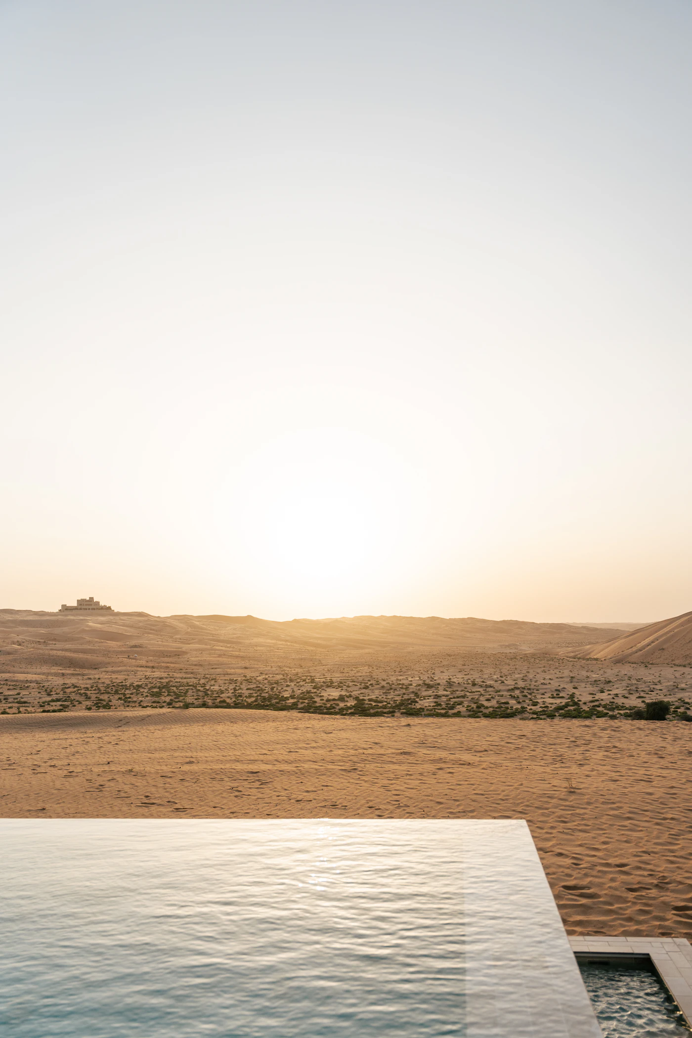 Dune Villa — desert infinity pool at sunset