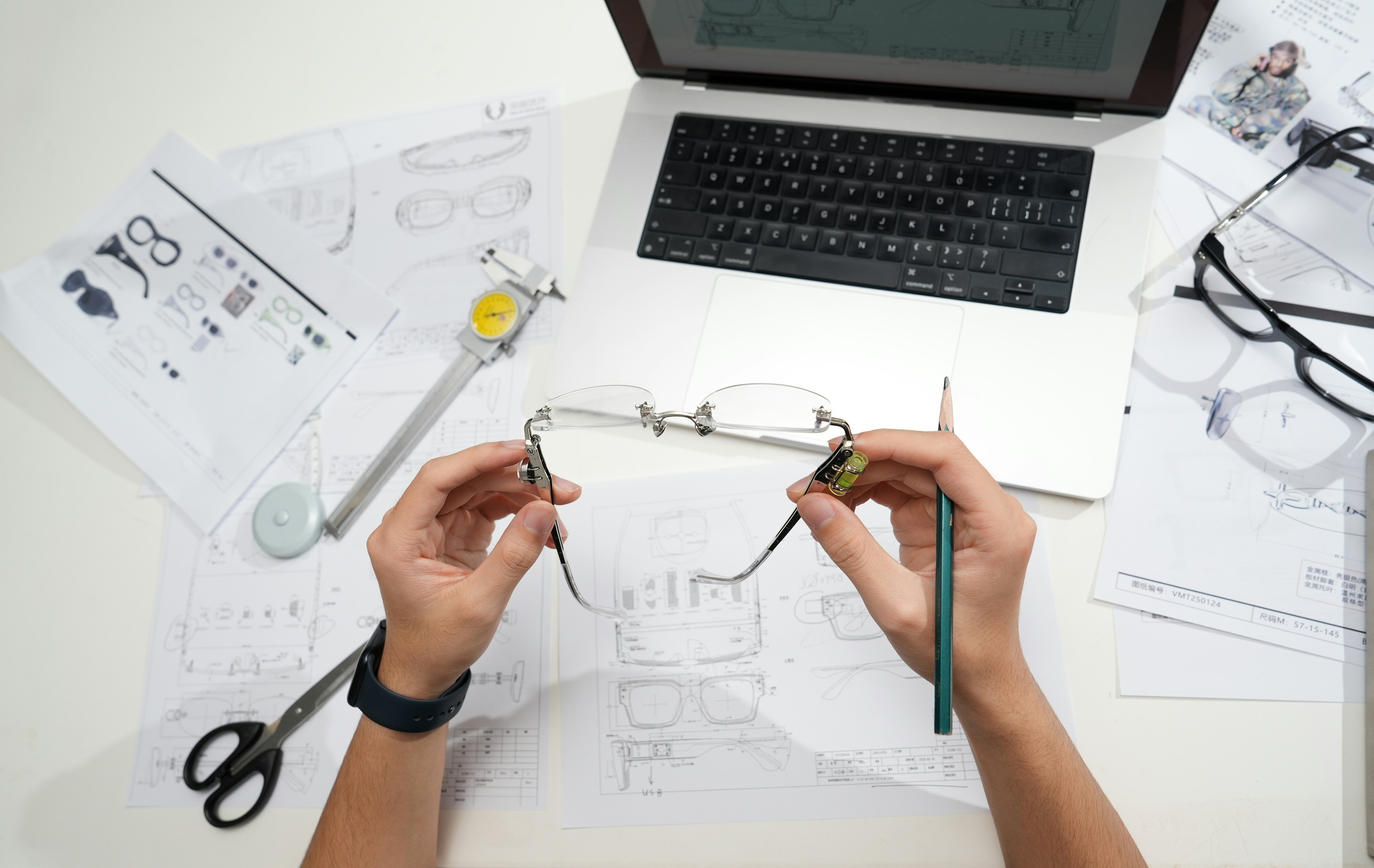 Designer workspace with glasses