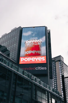 Popeyes billboard advertises big dipping sauces.