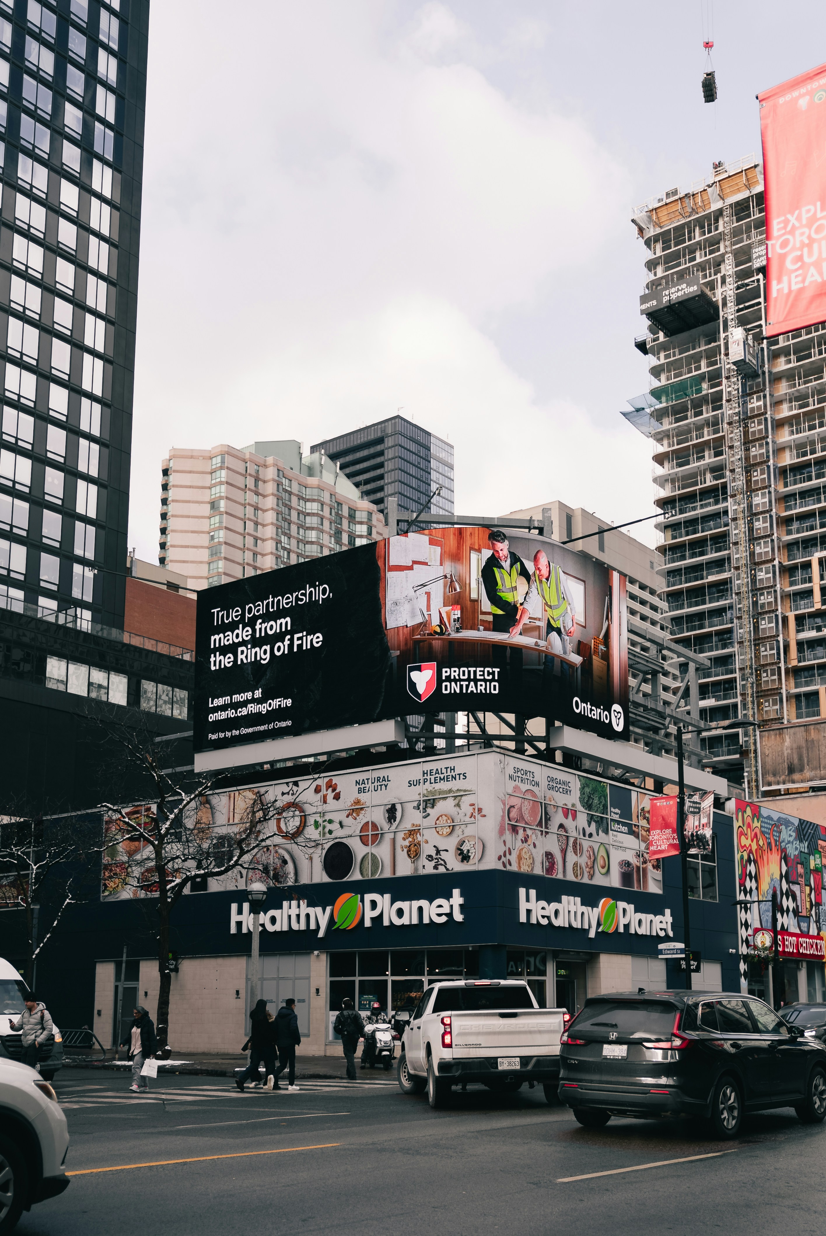 City street with buildings and a healthy planet store.