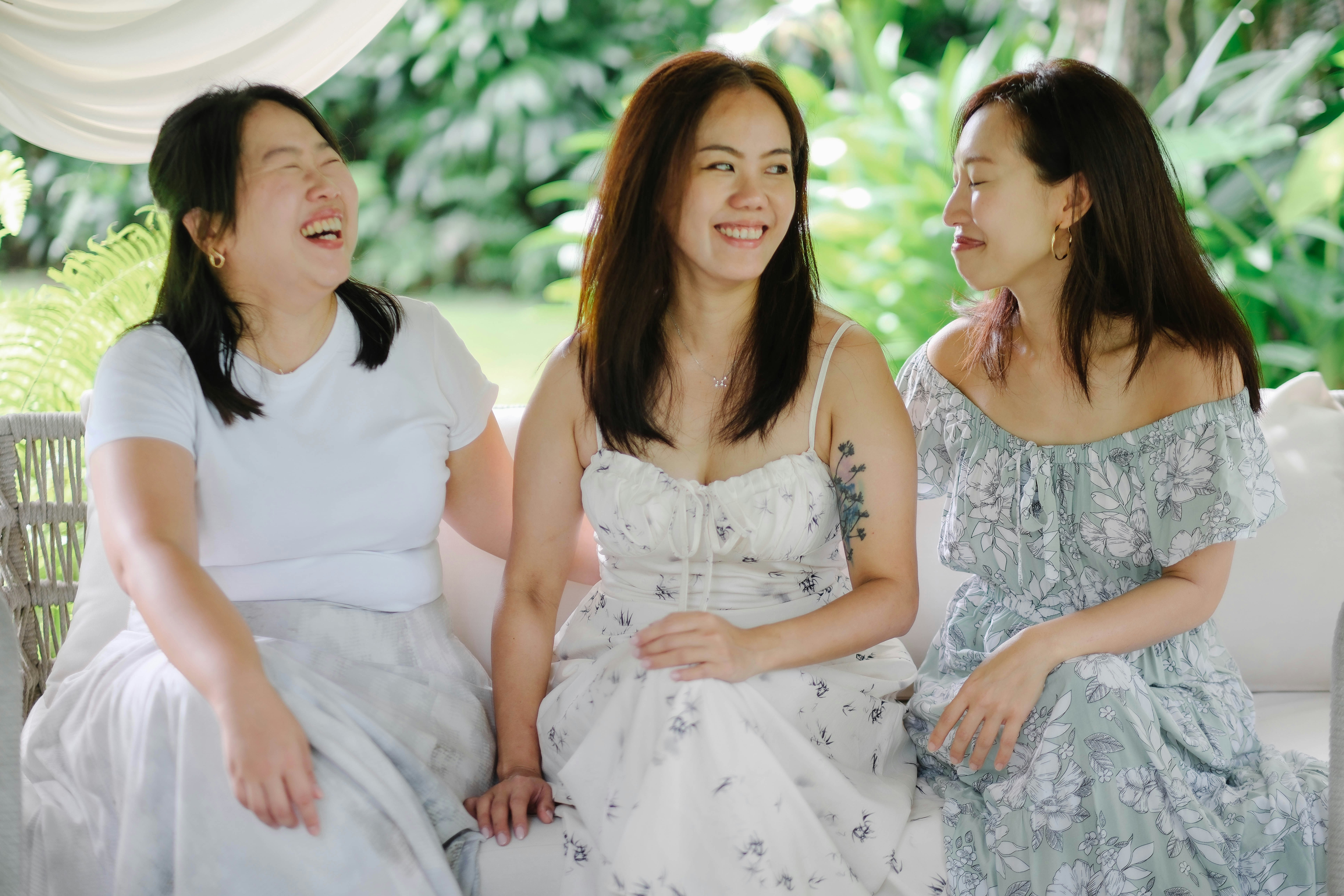 Three women laughing together