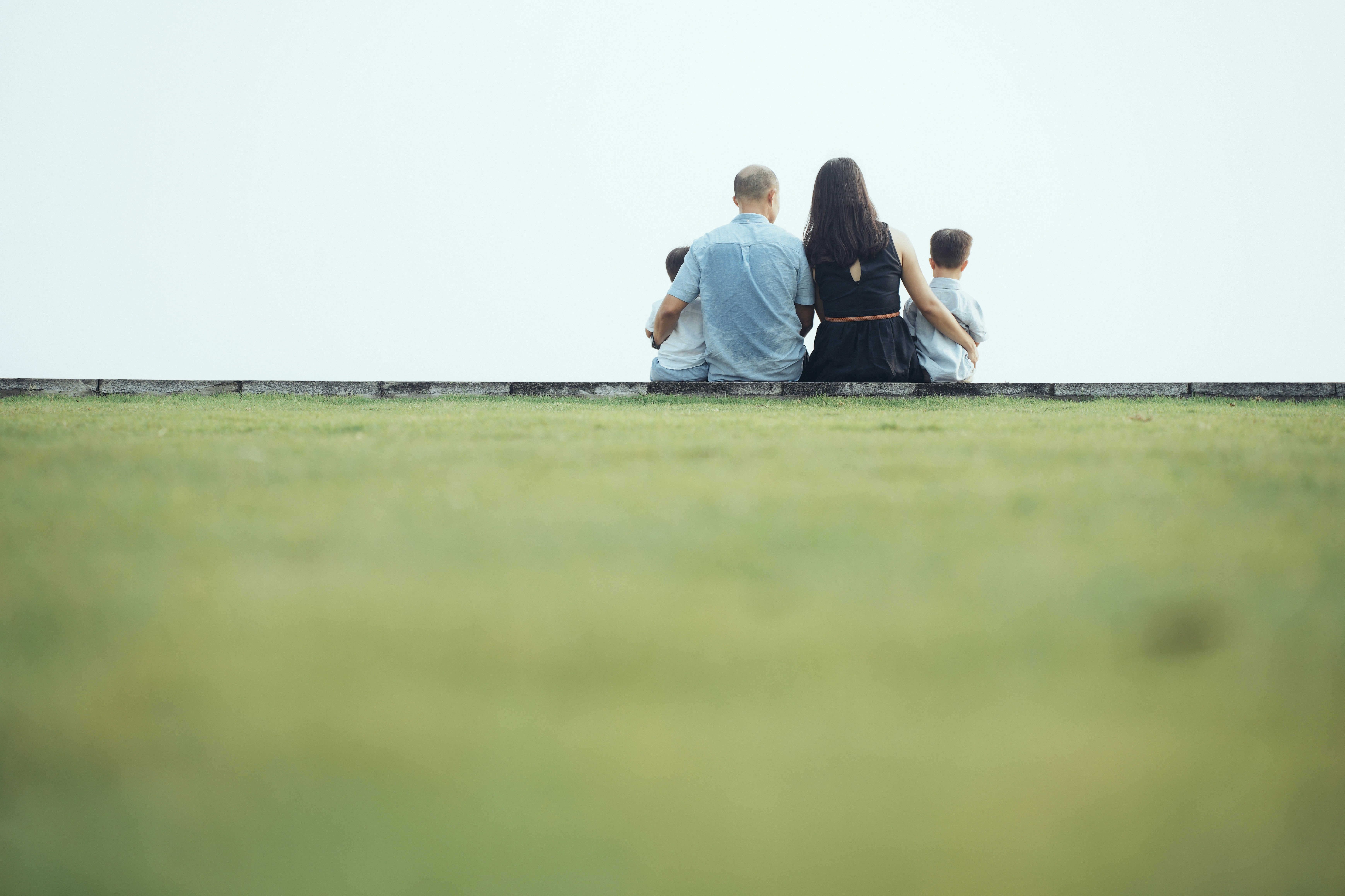 Family sitting together looking out at the view