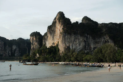 Beach with limestone cliffs and longtail boats