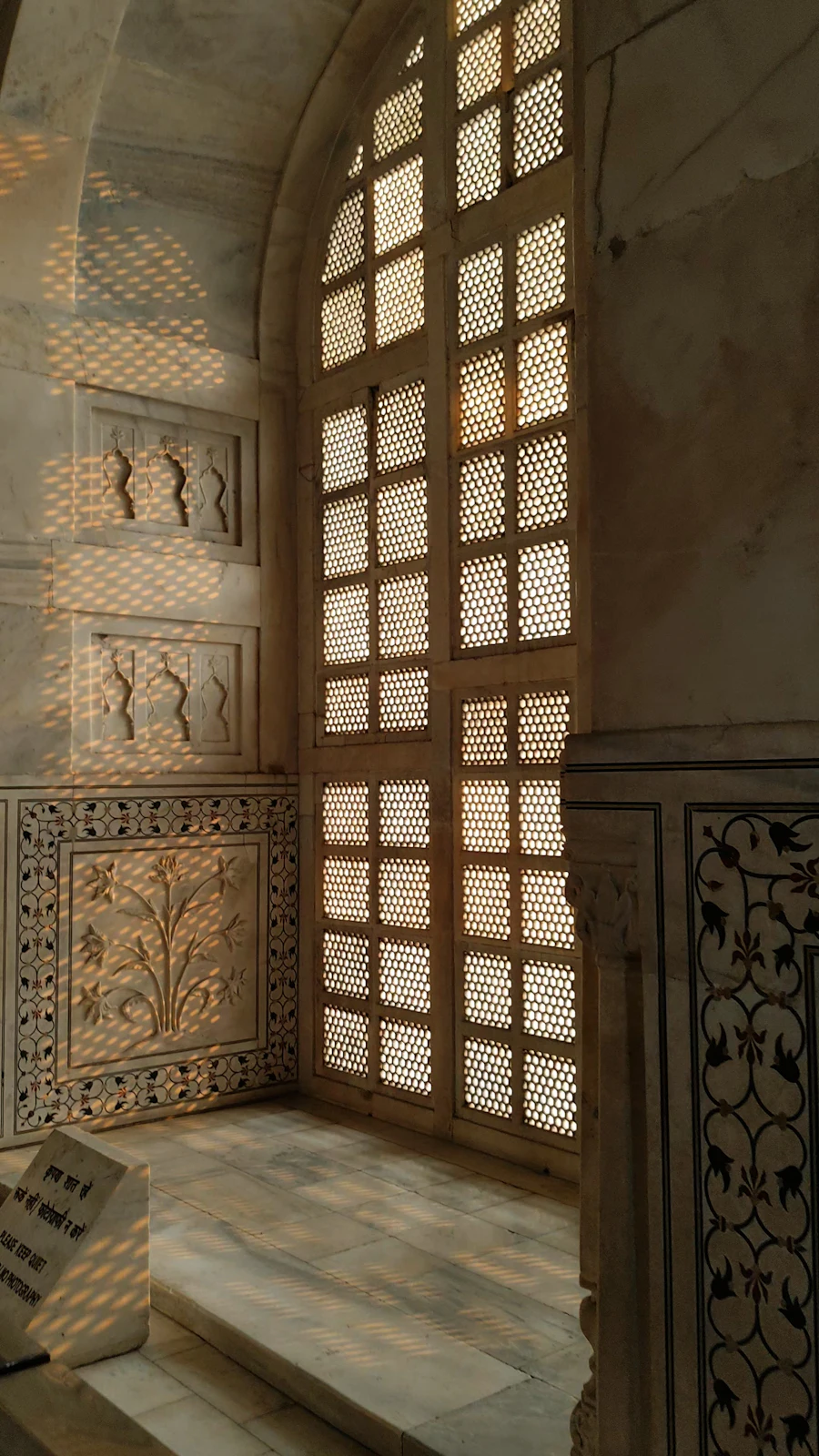 Sunlight through a carved marble window