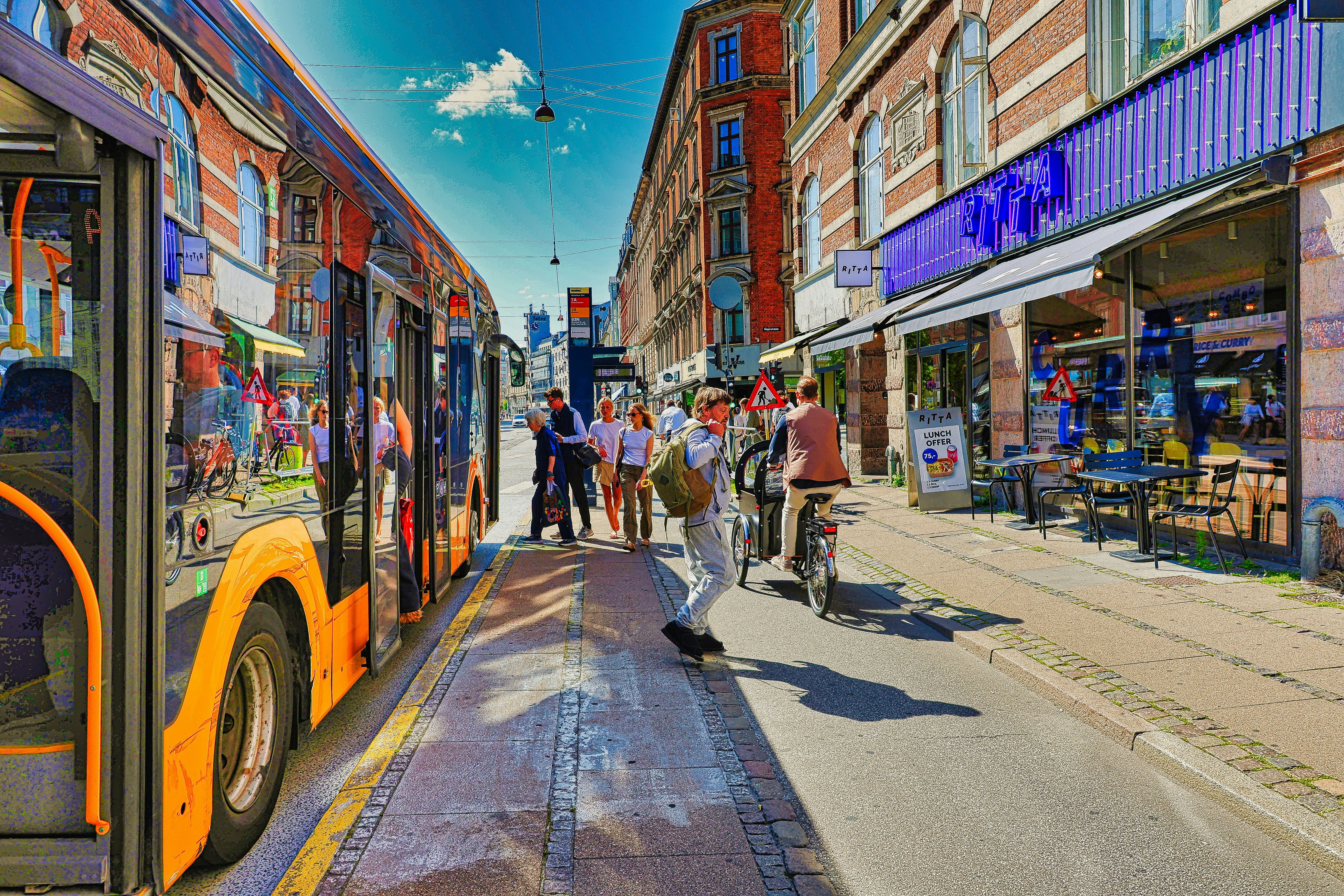 Urban street with cyclists and pedestrians sharing space