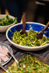 Fresh green salad in a blue bowl