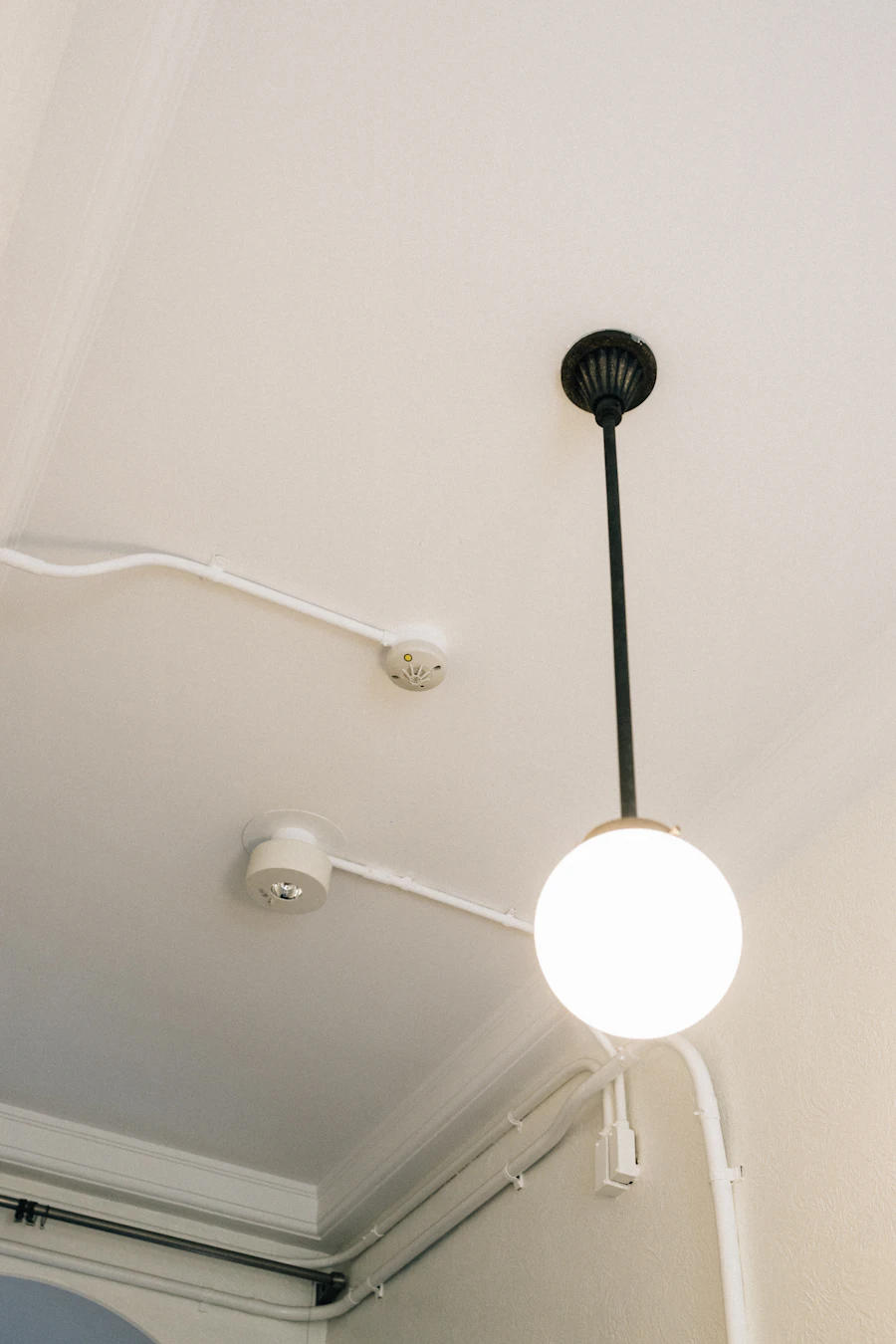 Ceiling sprinkler head installed in a finished residential space