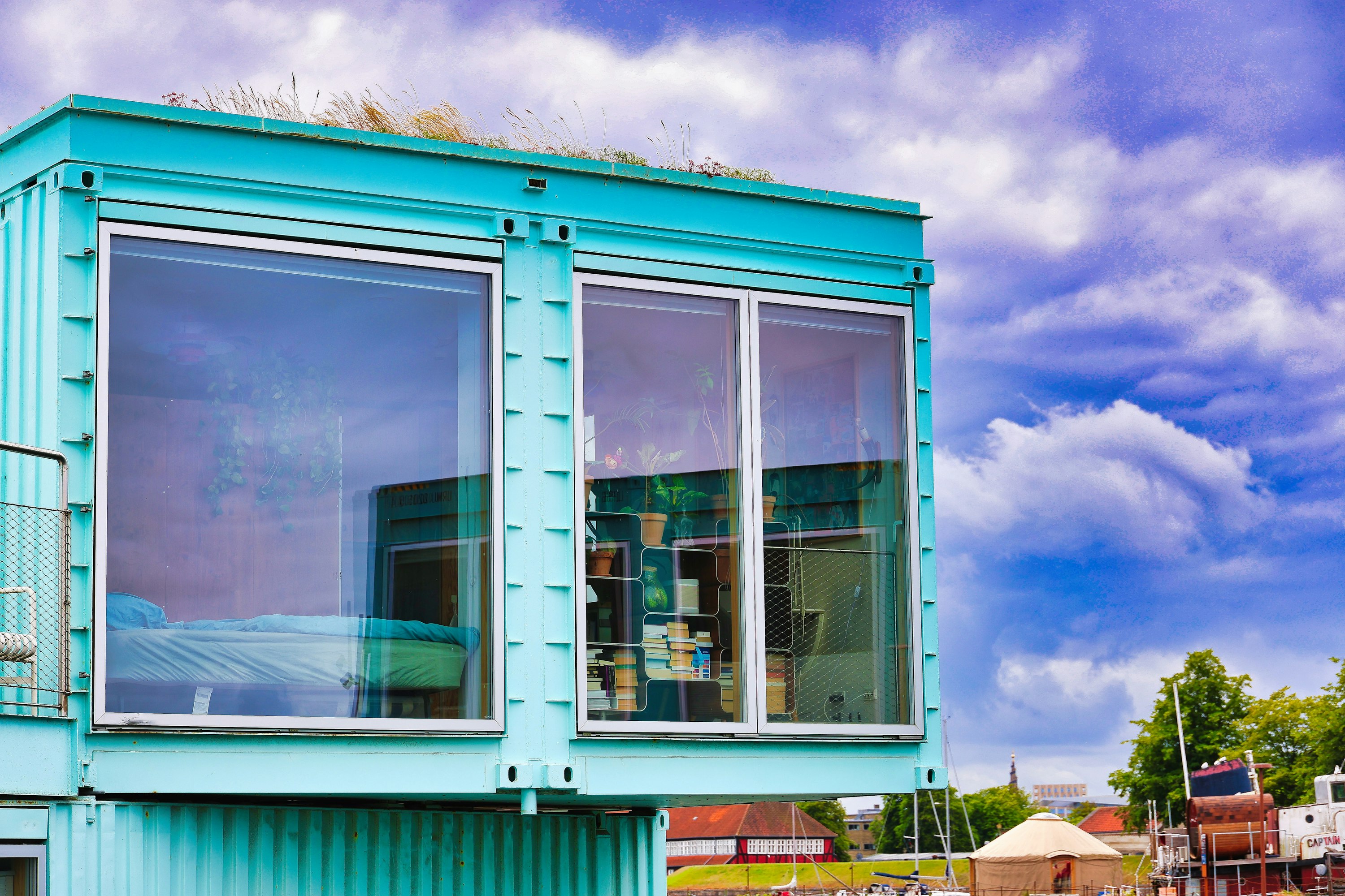 Modern turquoise shipping container modular home