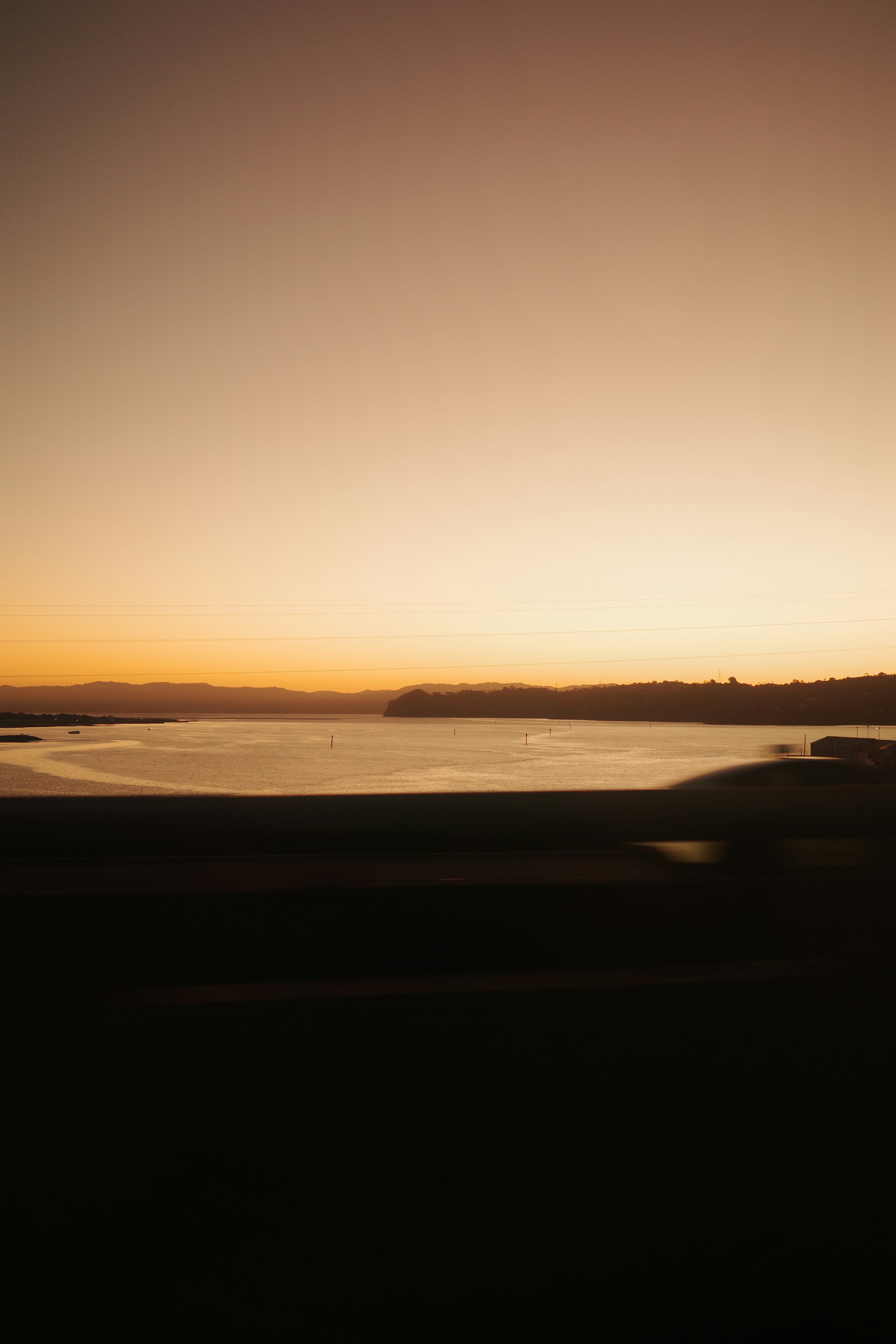 Sunset over a calm body of water