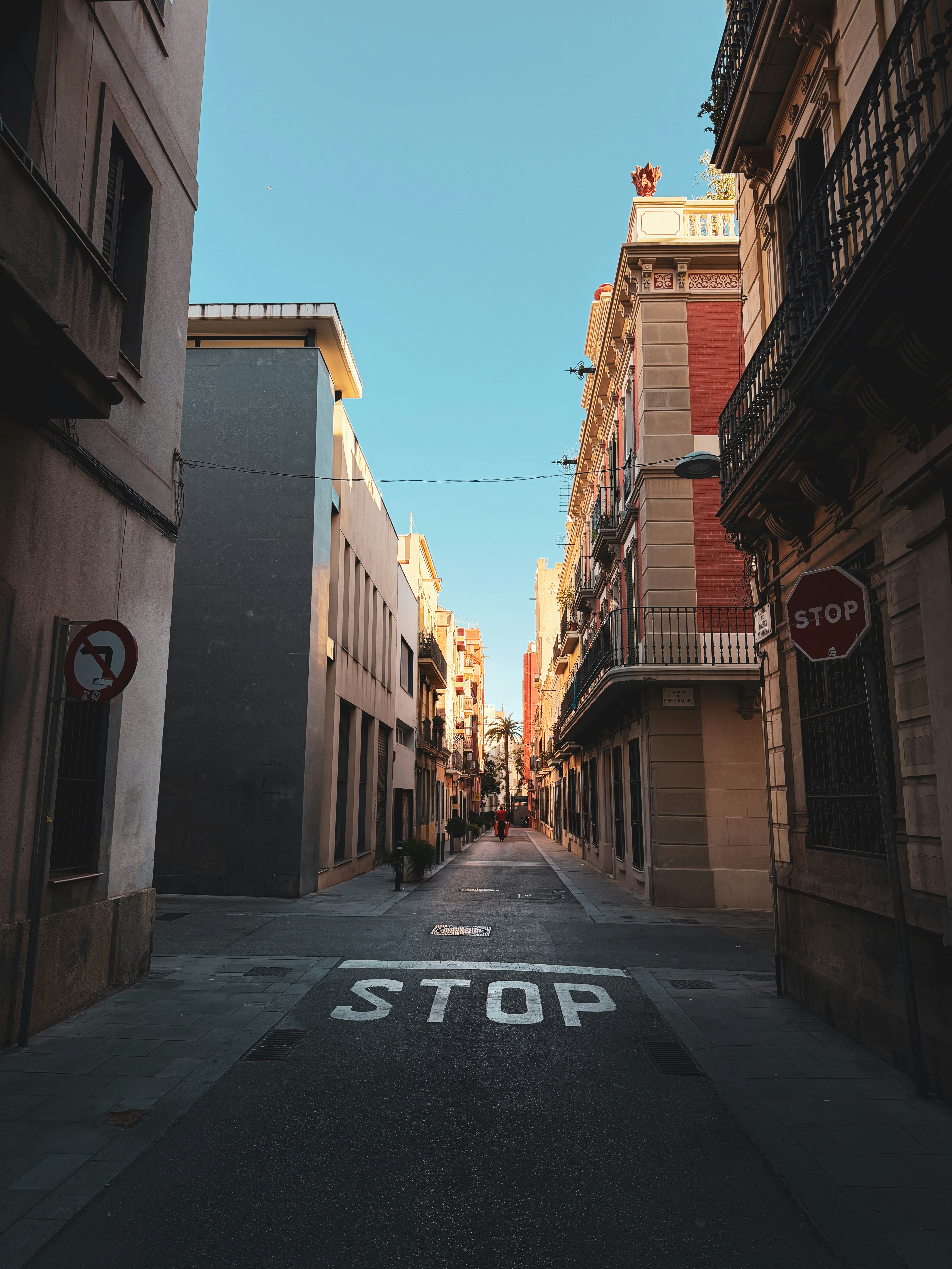 Street with buildings and a stop sign